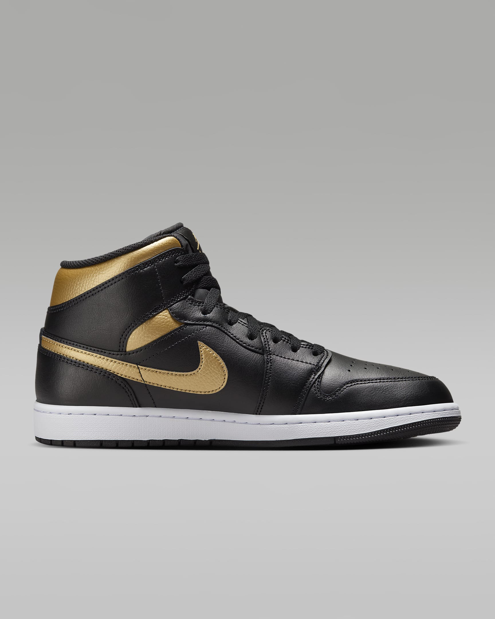 Air Jordan 1 Mid Schuh - Schwarz/Weiß/Metallic Gold