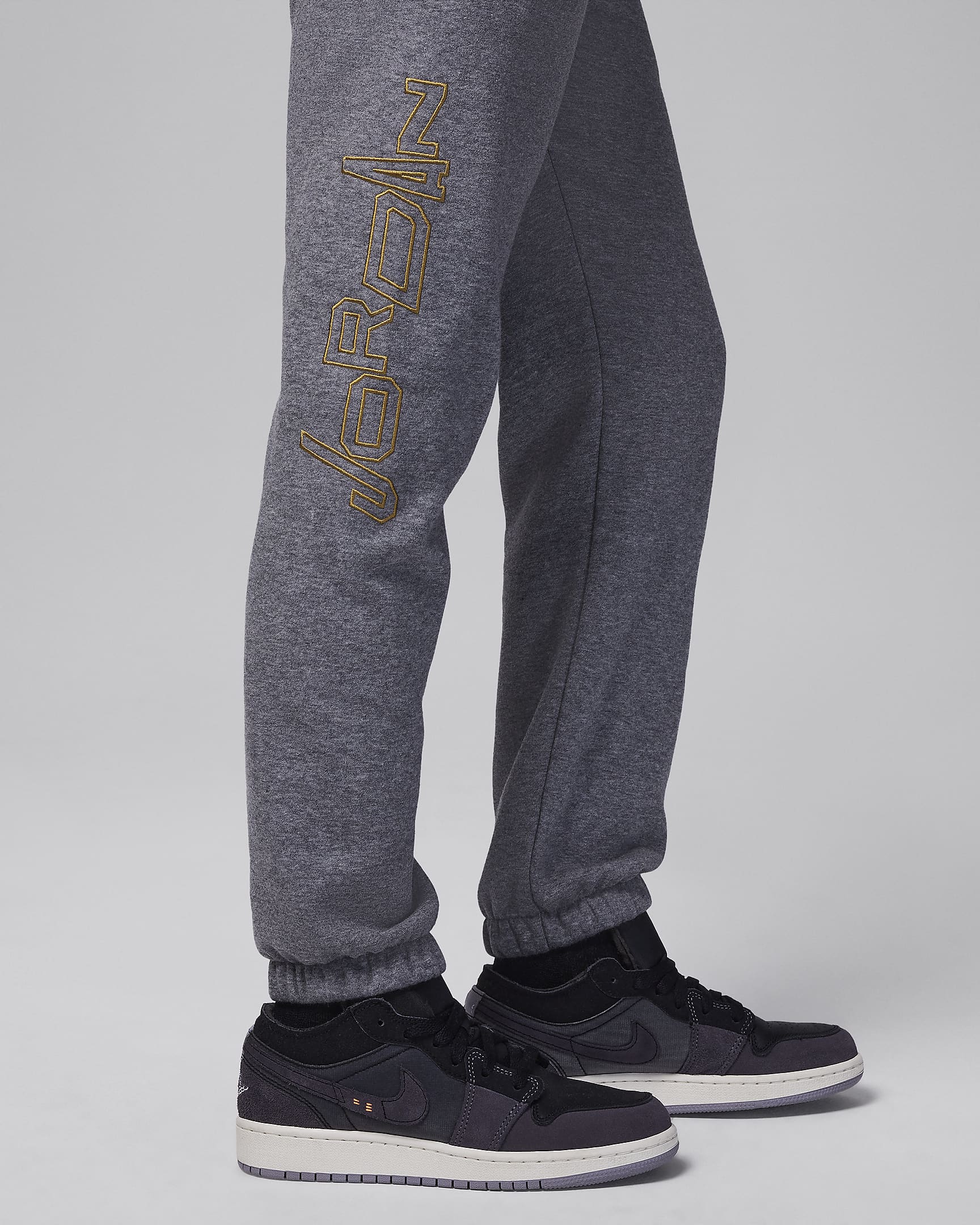 Jordan Take Flight Black and Gold Fleece Pants Big Kids Pants. Nike.com