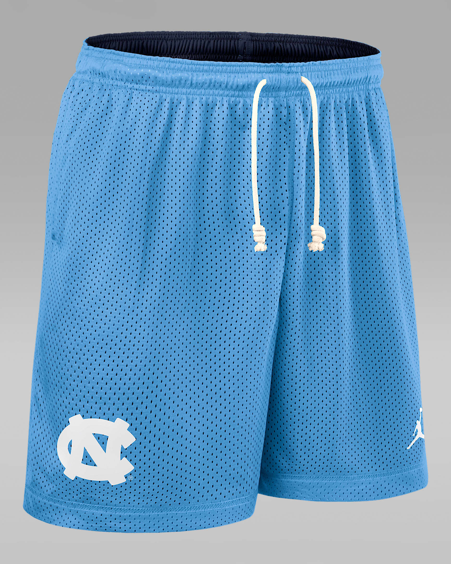 Shorts universitarios marca Jordan Dri-FIT para hombre North Carolina Sideline Reversible - Azul claro