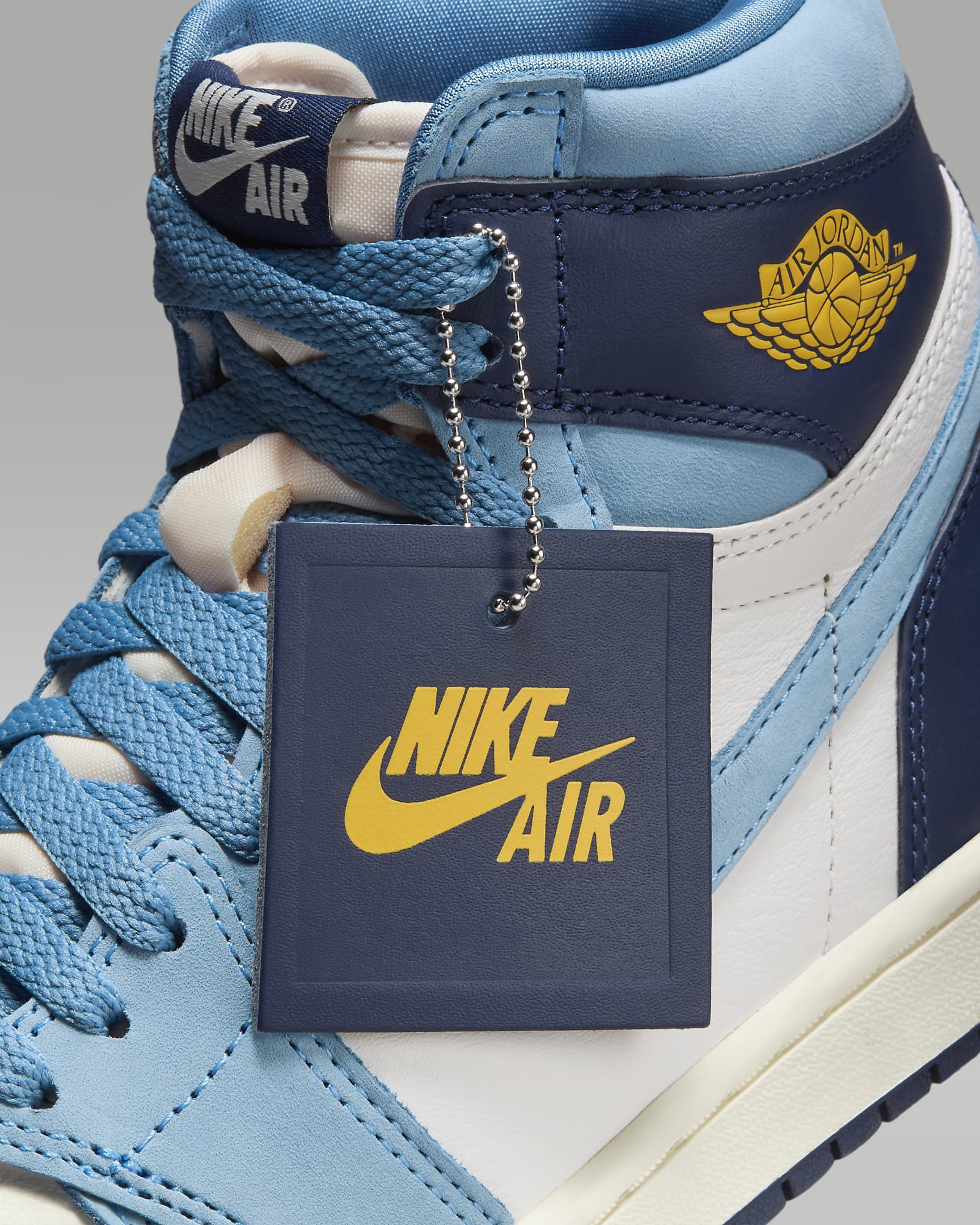 Air Jordan 1 Retro High OG "First in Flight" Women's Shoes - University Blue/Sail/Midnight Navy/University Gold