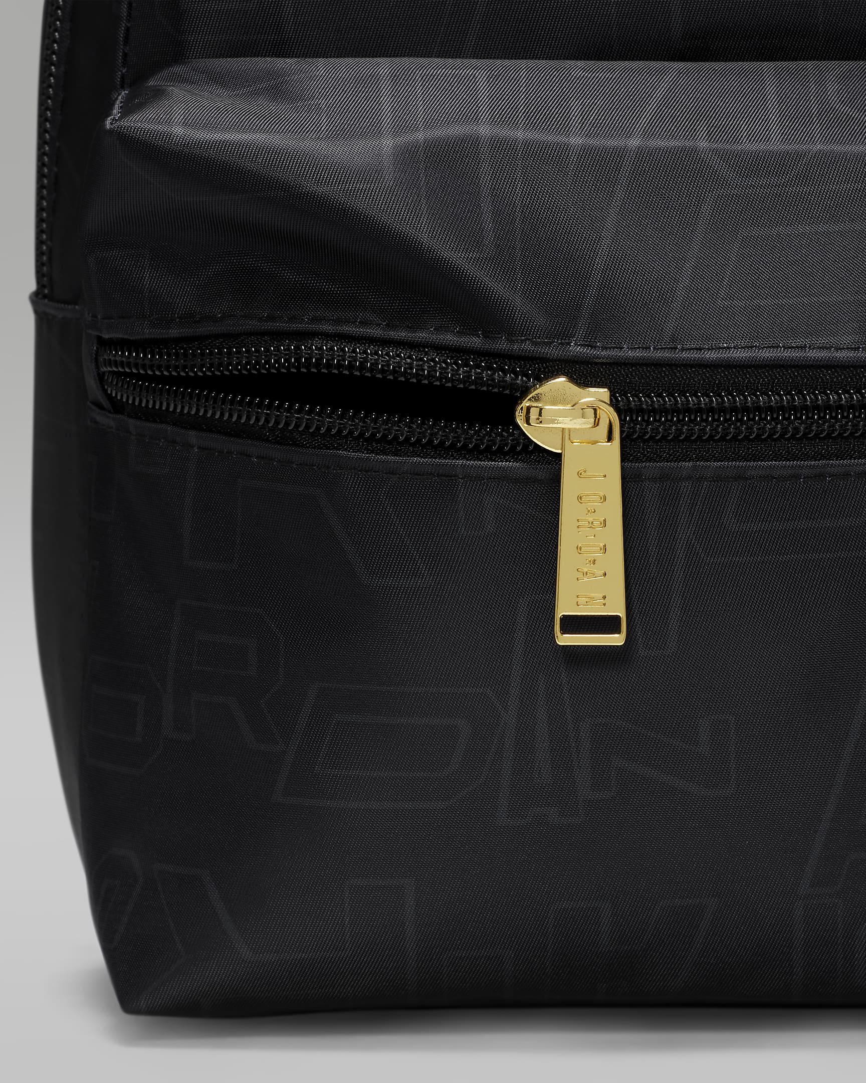Jordan Black and Gold Mini Backpack Backpack (10L). Nike UK