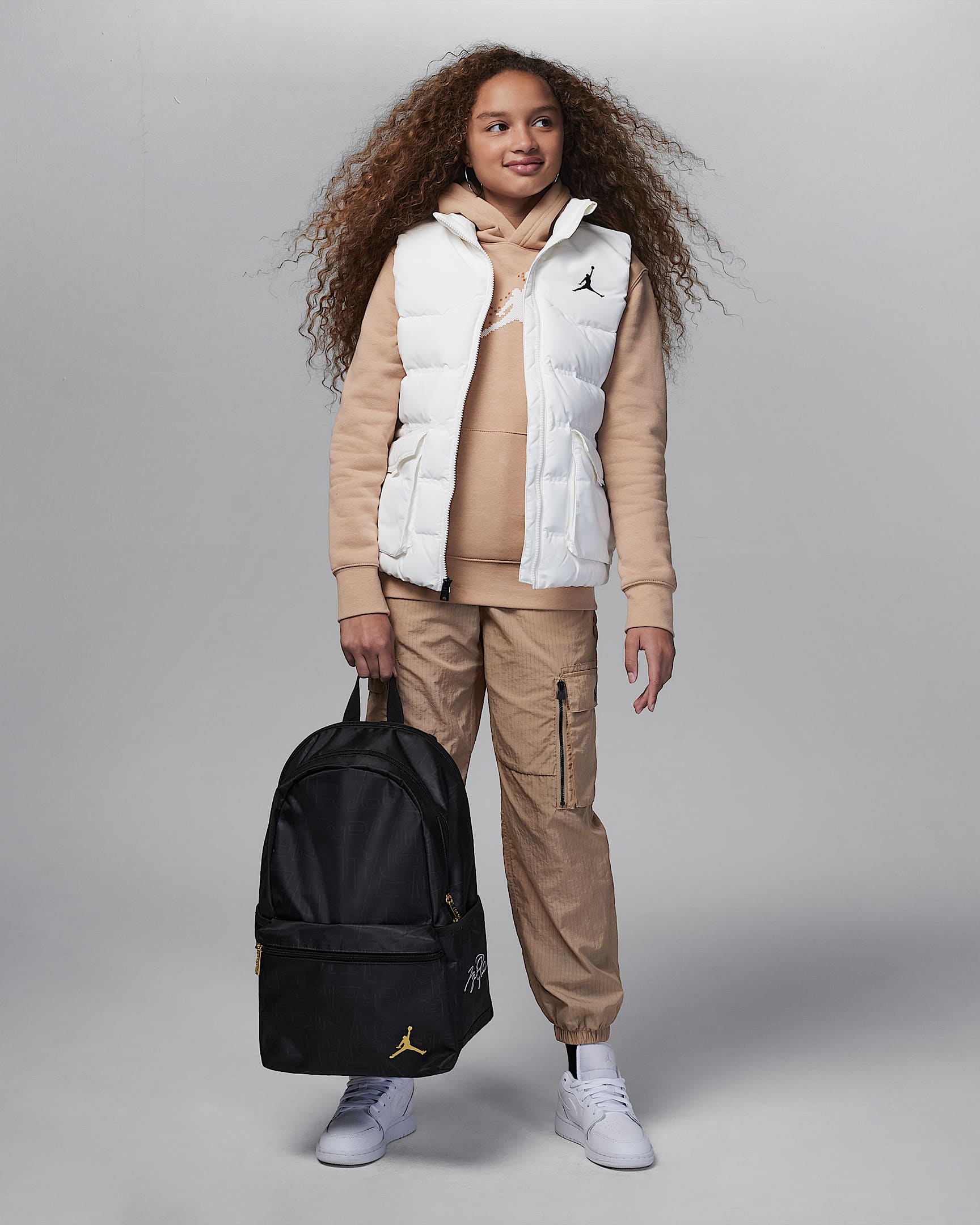 Jordan Black and Gold Backpack Backpack (19L). Nike UK