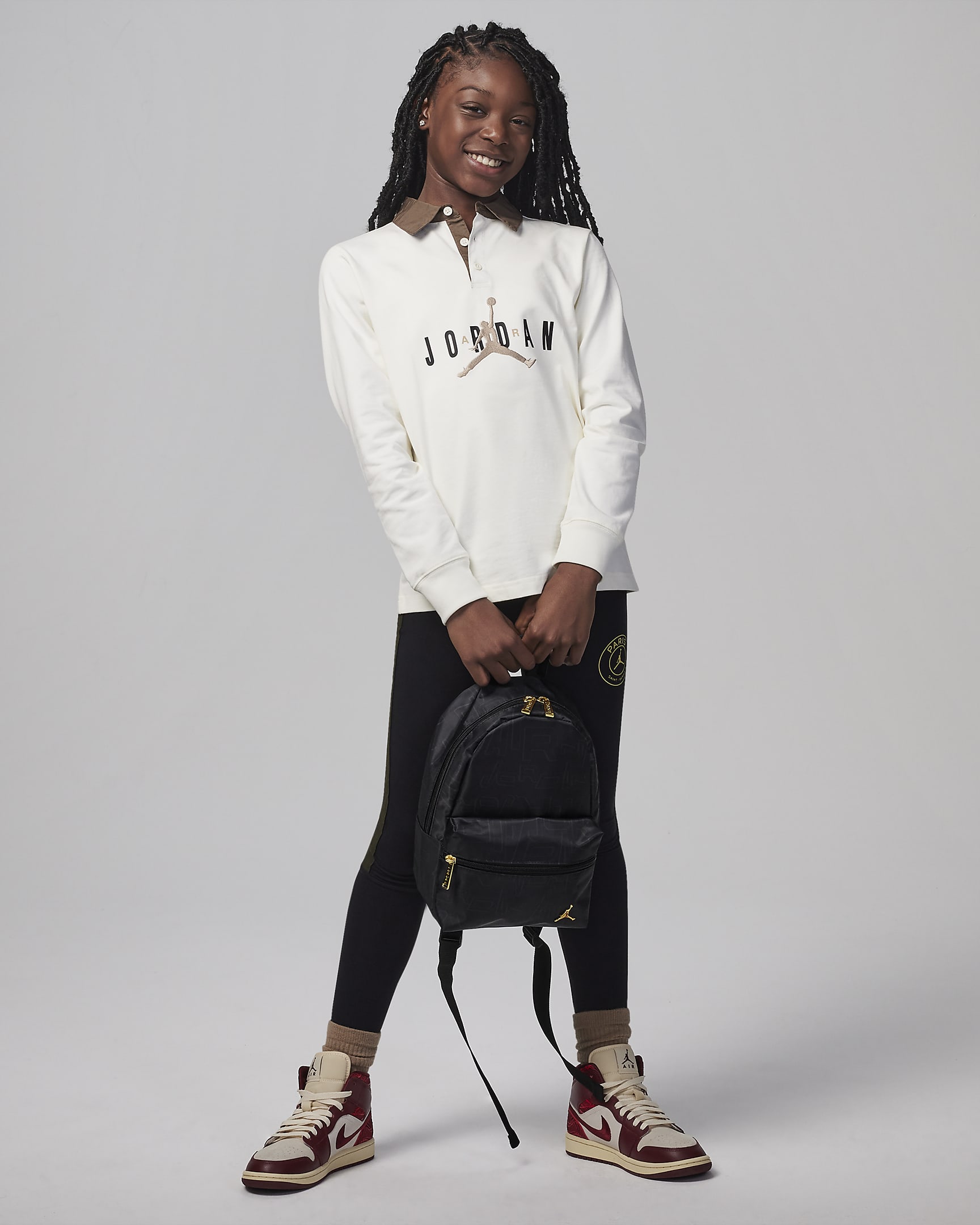 Jordan Black and Gold Mini Backpack Backpack (10L). Nike UK