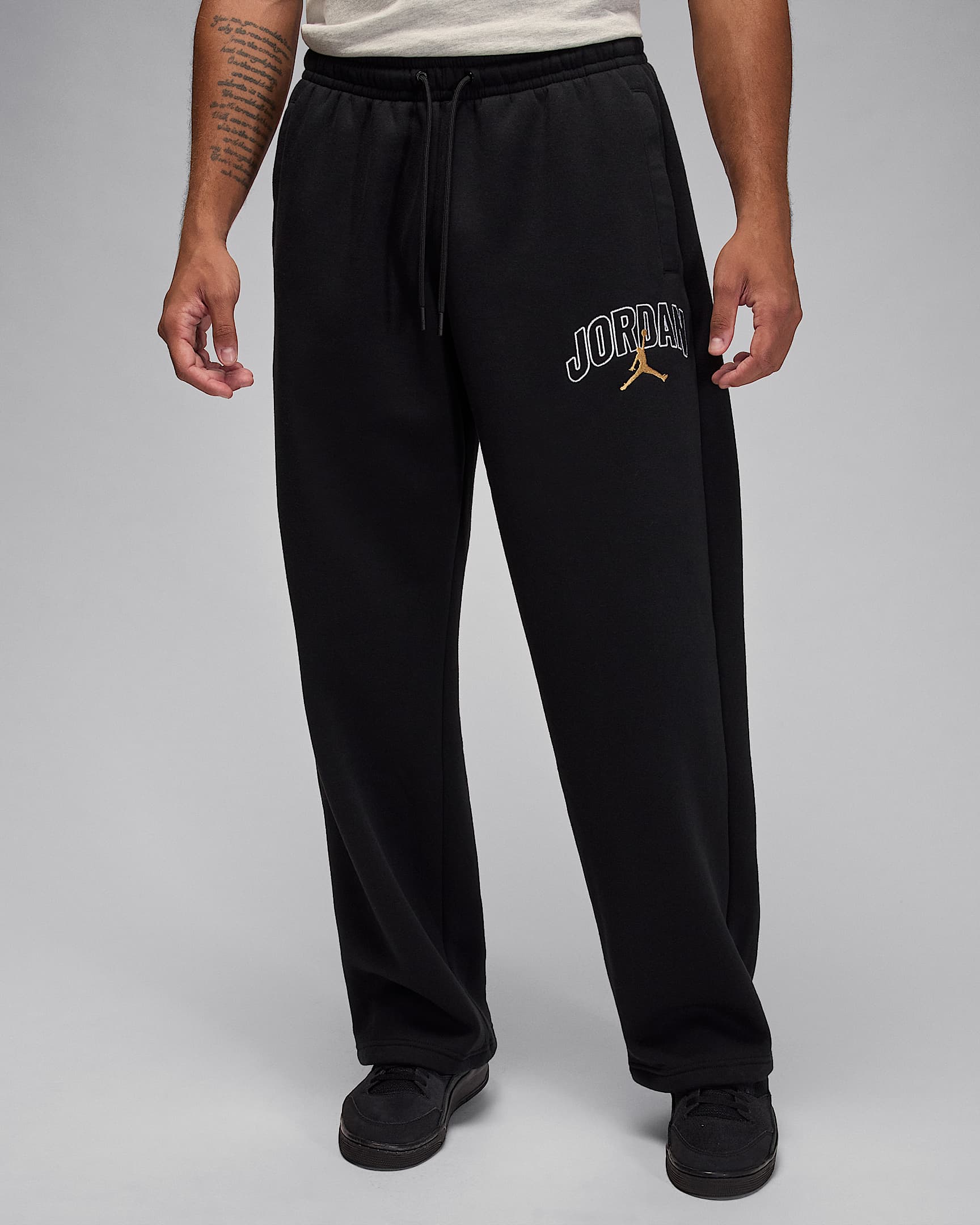Jordan Brooklyn Fleece oversized broek met open zoom voor heren - Zwart/Metallic Gold