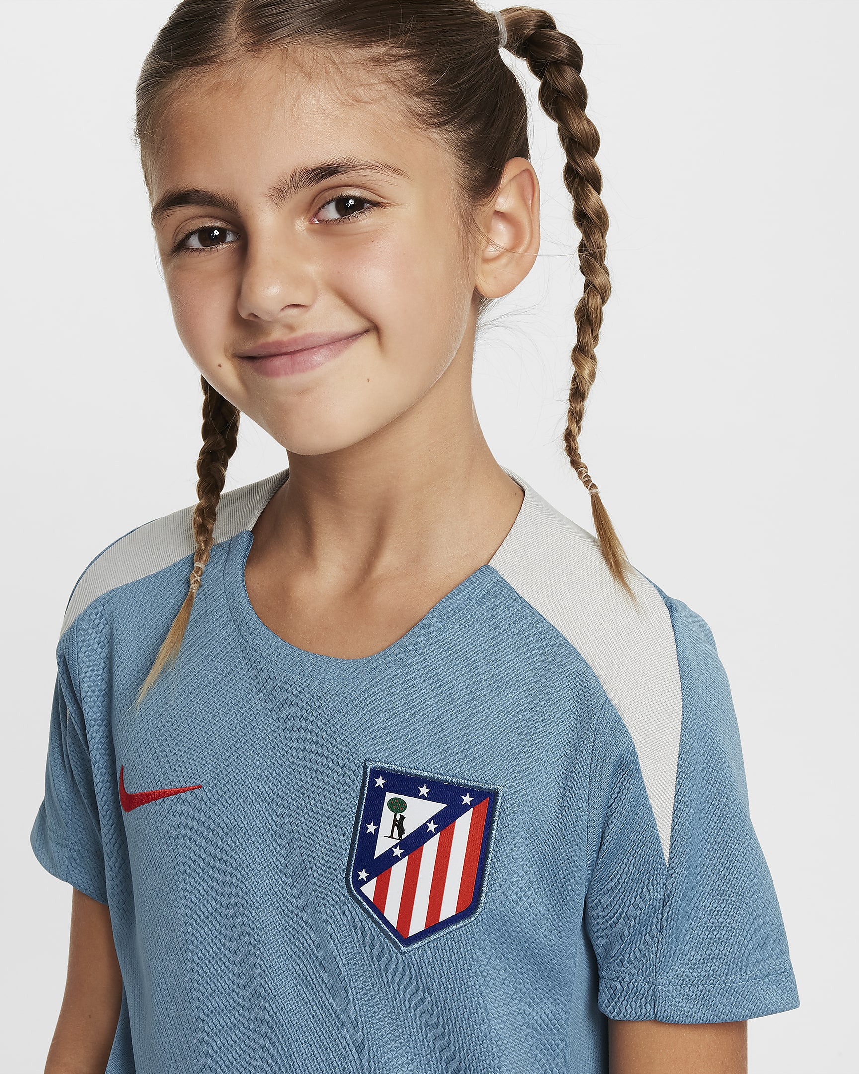 Atlético Madrid Strike Older Kids' Nike Dri-FIT Football Short-Sleeve Knit Top - Noise Aqua/Light Iron Ore/Light Crimson