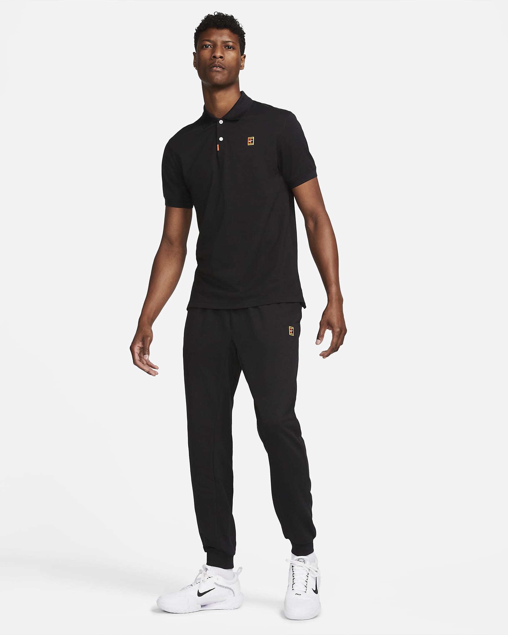 Calças de ténis em tecido moletão NikeCourt Heritage para homem - Preto