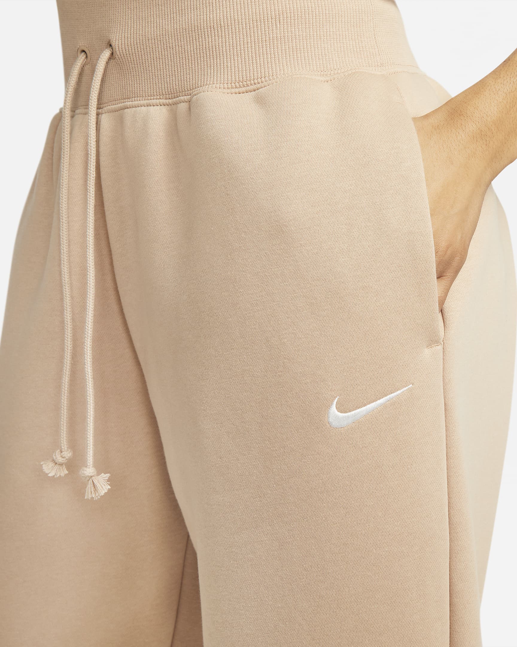 Calças de fato de treino folgadas de cintura subida Nike Sportswear Phoenix Fleece para mulher - Hemp/Sail