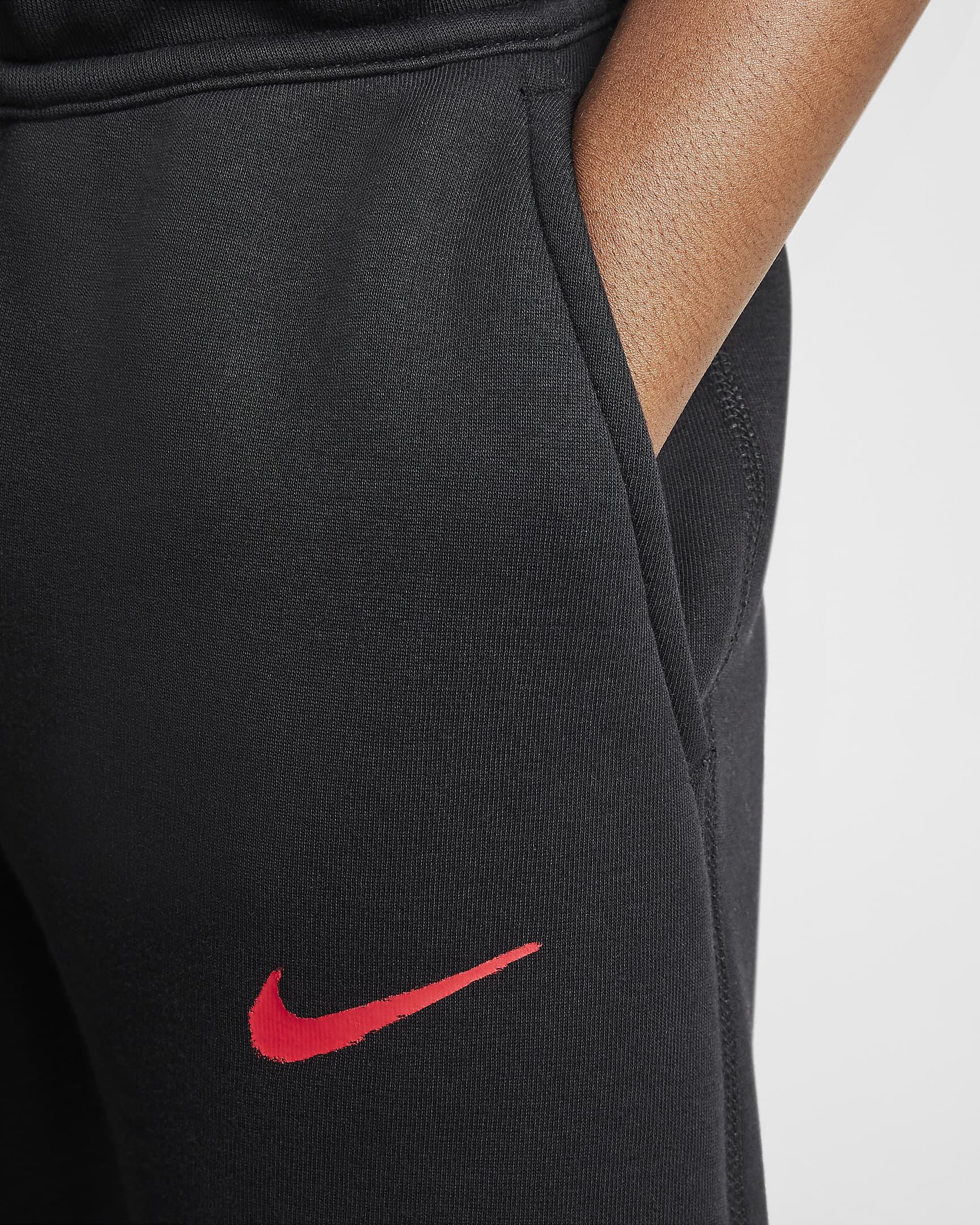 Paris Saint-Germain Tech Fleece Nike Football-bukser til større børn (drenge) - sort/University Red