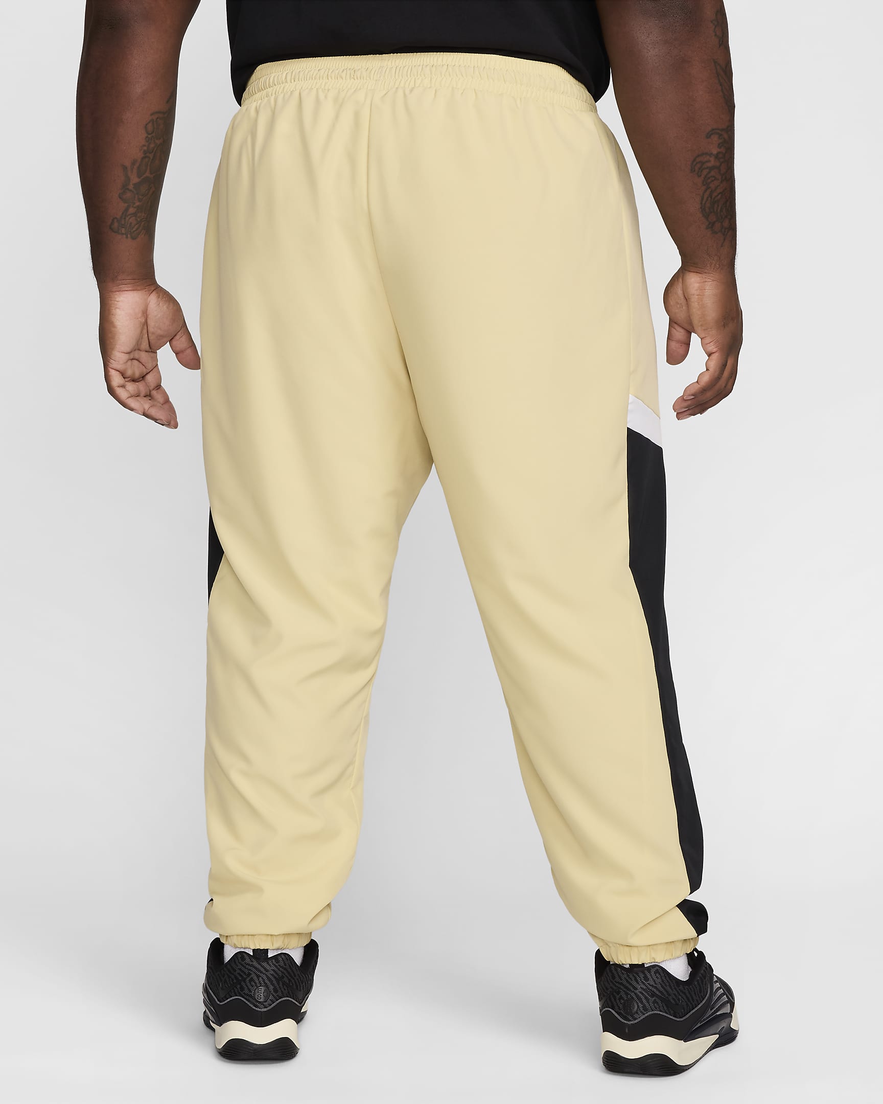 Pantaloni in tessuto da basket Nike Icon – Uomo - Team Gold/Nero/Bianco/Nero