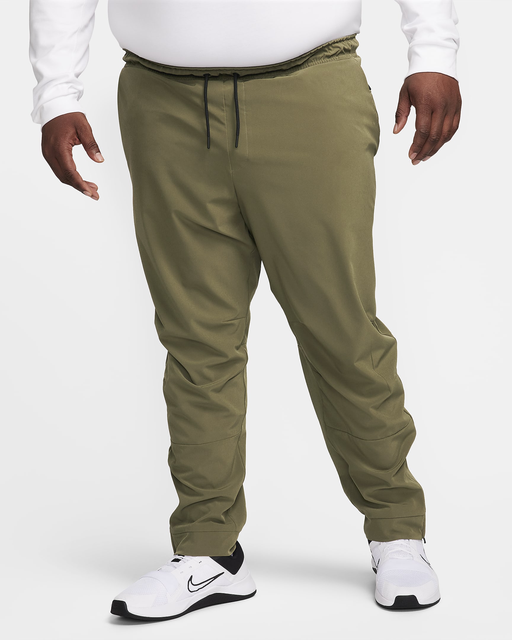 Nike Unlimited Men's DriFIT Zip Cuff Versatile Trousers. Nike BE