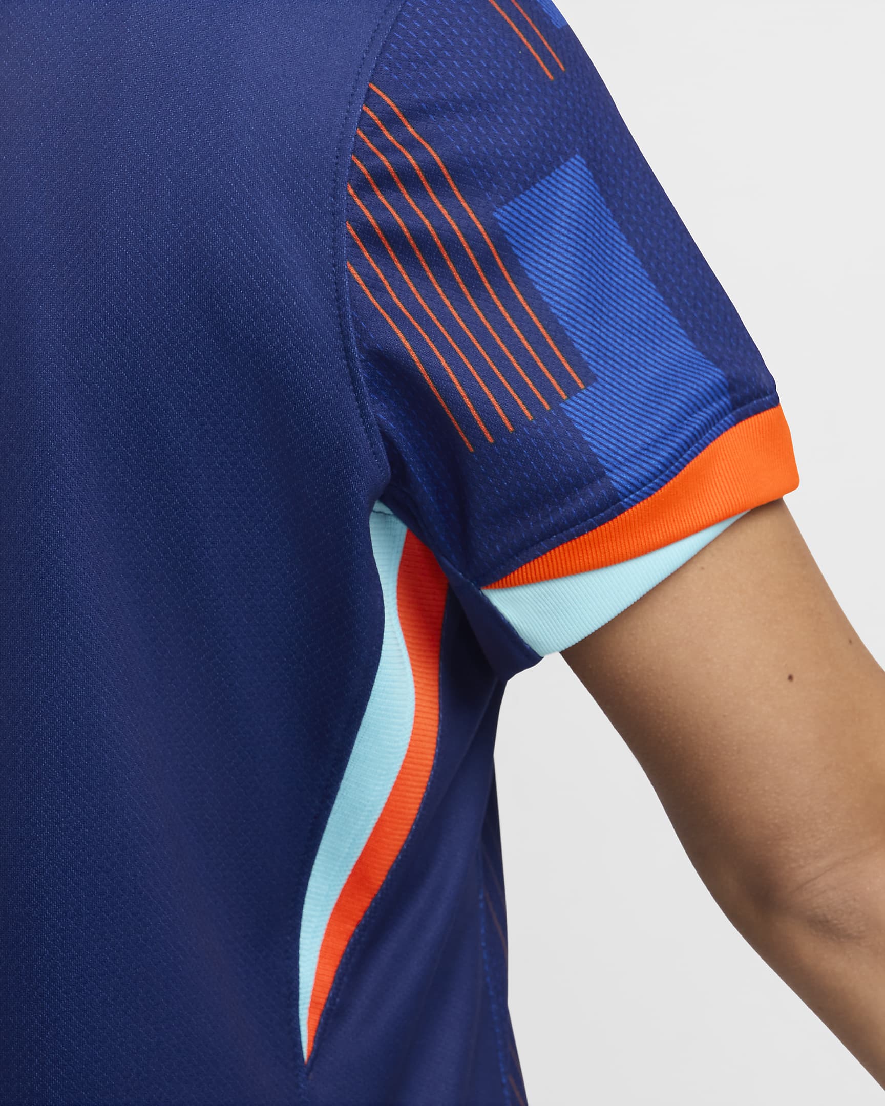 Replika dámského venkovního fotbalového dresu Nike Dri-FIT Nizozemsko (ženský tým) Stadium 2024/25 - Blue Void/Safety Orange/Copa/Bílá