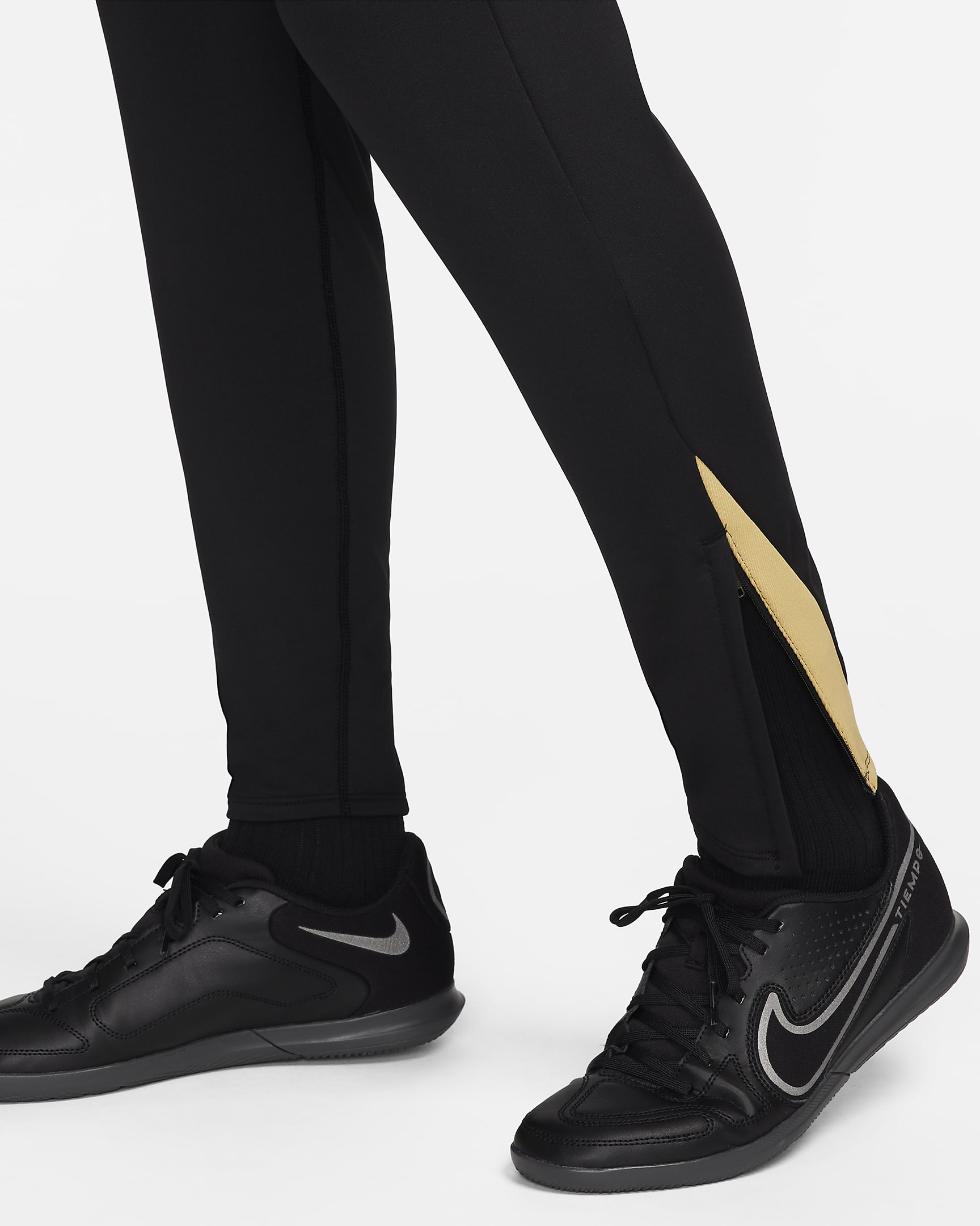 Nike Strike Dri-FIT fotballbukse til dame - Svart/Jersey Gold/Metallic Gold