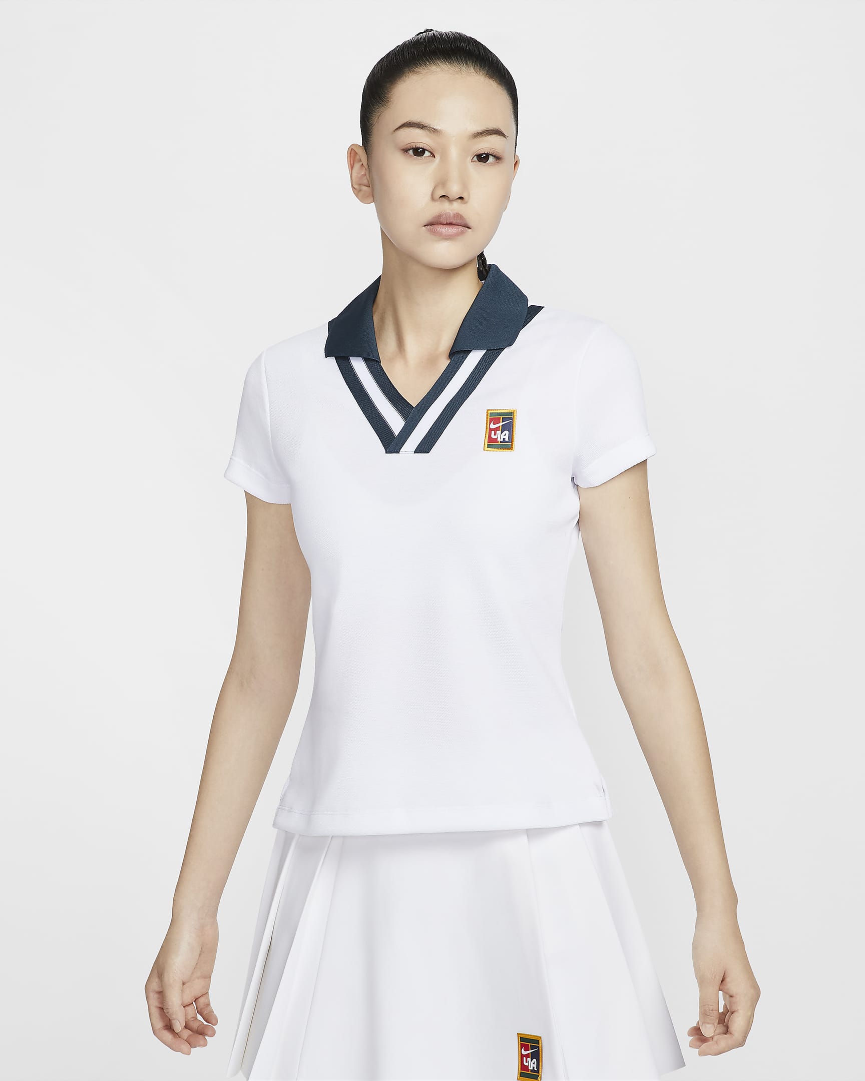 เสื้อโปโลแขนสั้นผู้หญิง Nike Women by YOON - ขาว/Armory Navy