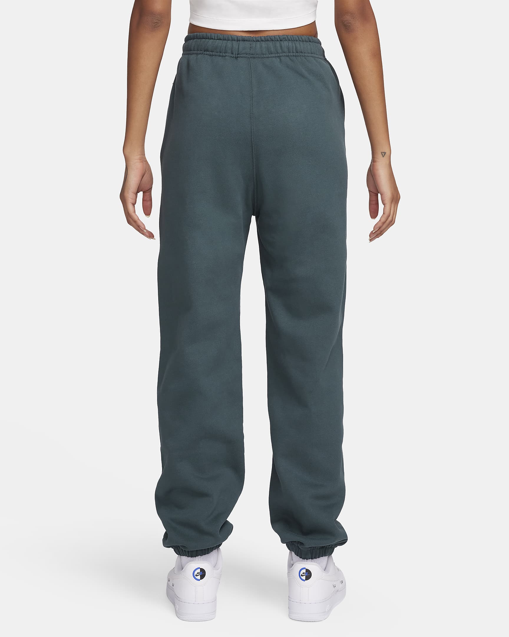 Pantaloni in fleece Nike Solo Swoosh - Donna - Deep Jungle/Bianco