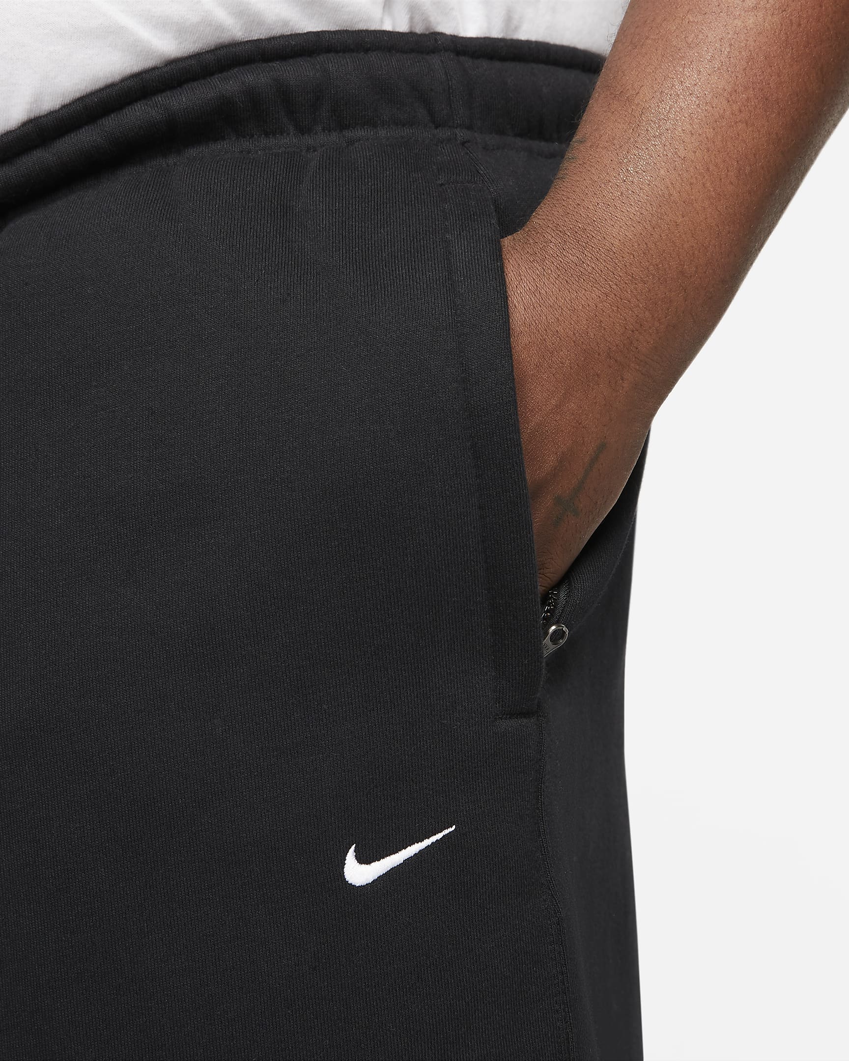 Pantalon en tissu Fleece Nike Solo Swoosh pour Homme - Noir/Blanc