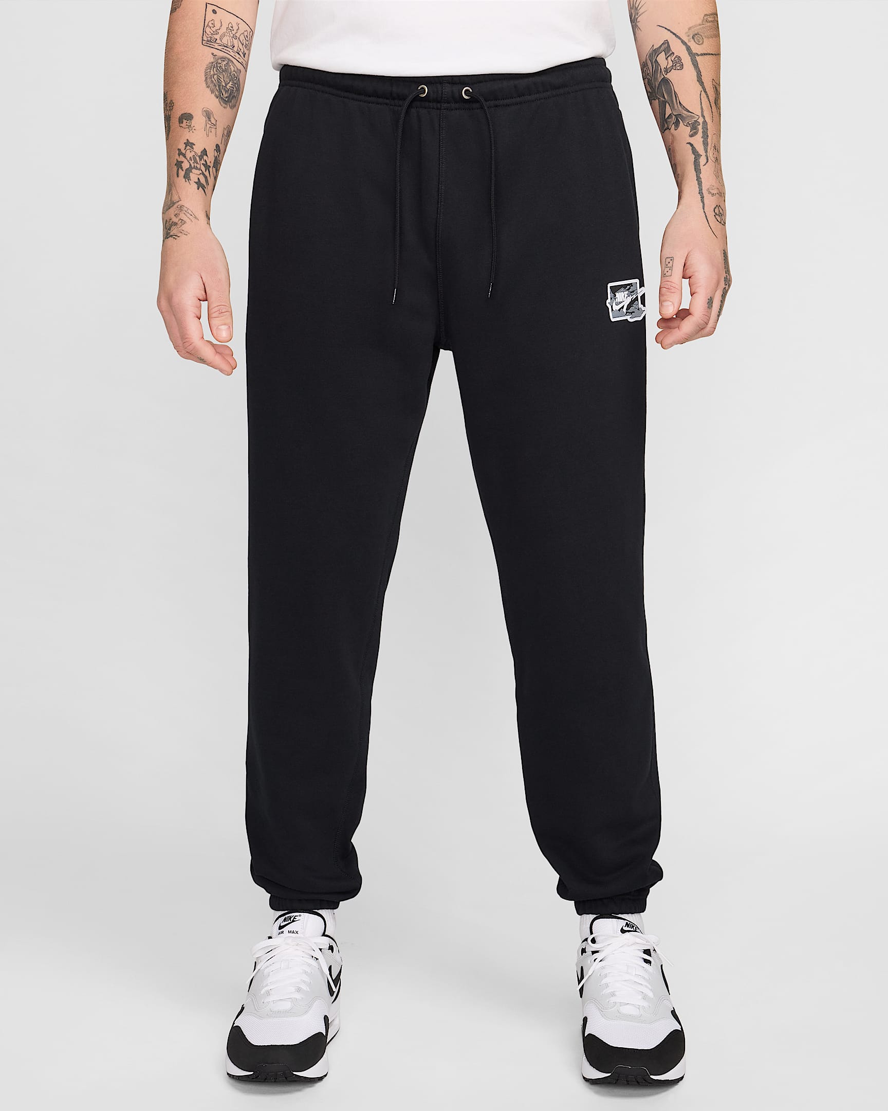 Pants de French Terry con puño para hombre Nike Club - Negro/Blanco