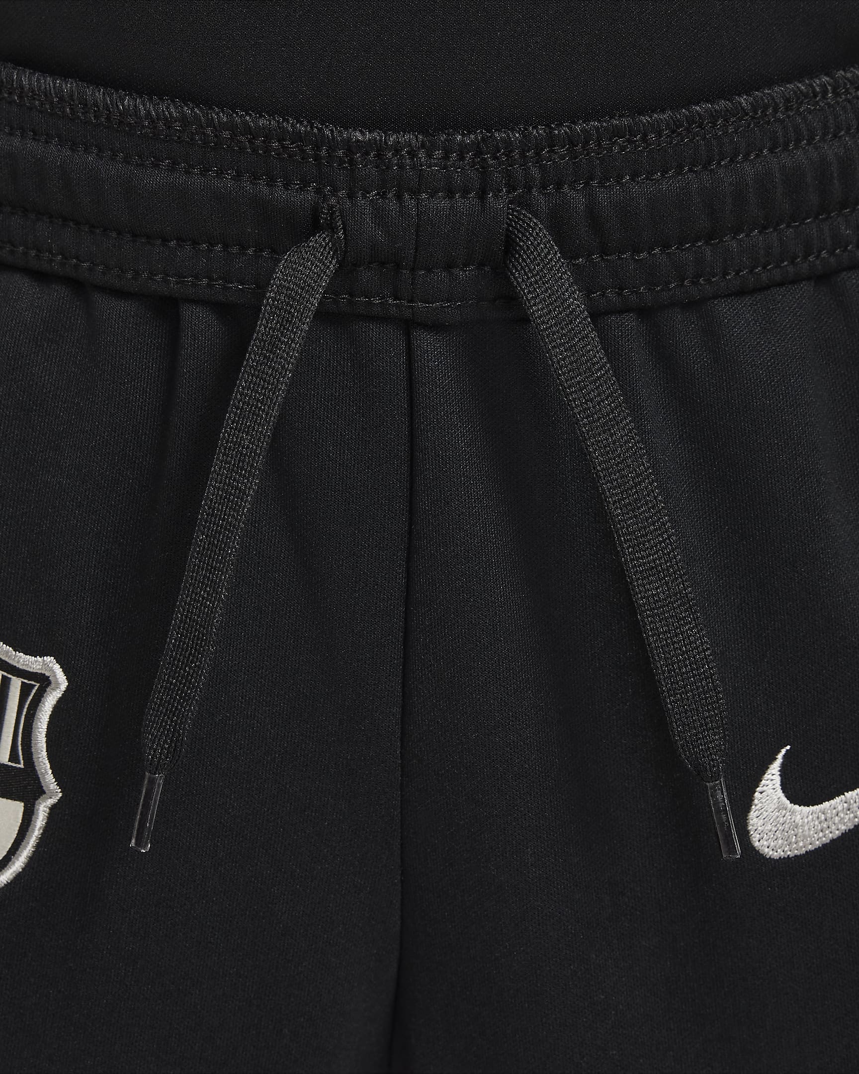 FC Barcelona Academy Pro Nike Dri-FIT Fußballhose aus Strick für jüngere Kinder - Schwarz/Noble Red/Deep Royal Blue/Light Orewood Brown