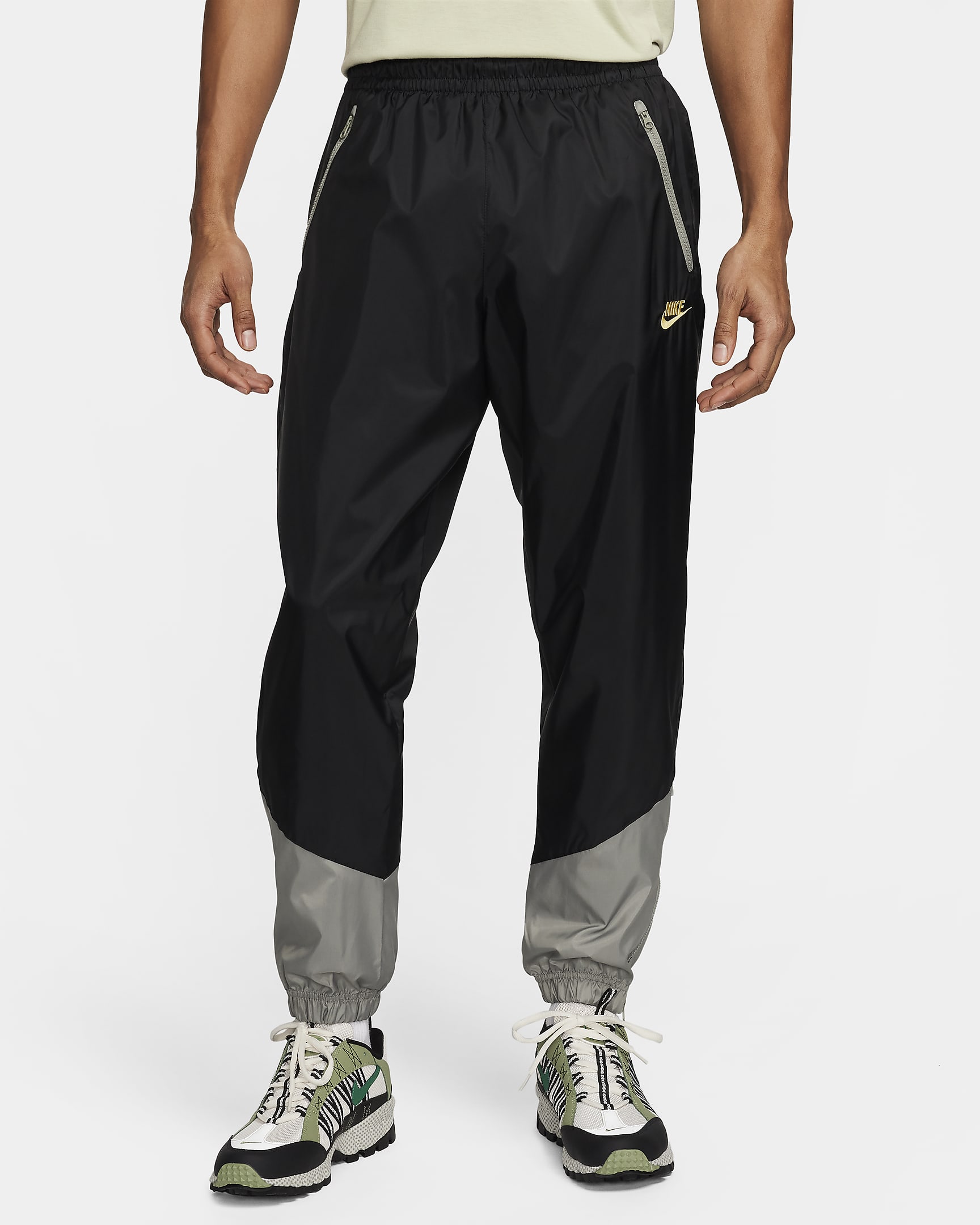 Pantalon doublé en tissu tissé Nike Windrunner pour homme - Noir/Dark Stucco/Saturn Gold