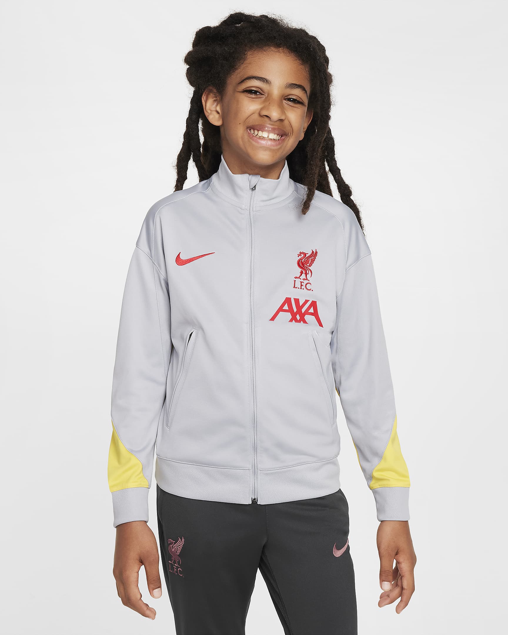 Dzianinowy dres piłkarski dla dużych dzieci Nike Dri-FIT Liverpool F.C. Strike (wersja trzecia) - Light Smoke Grey/Dark Smoke Grey/Chrome Yellow/Global Red