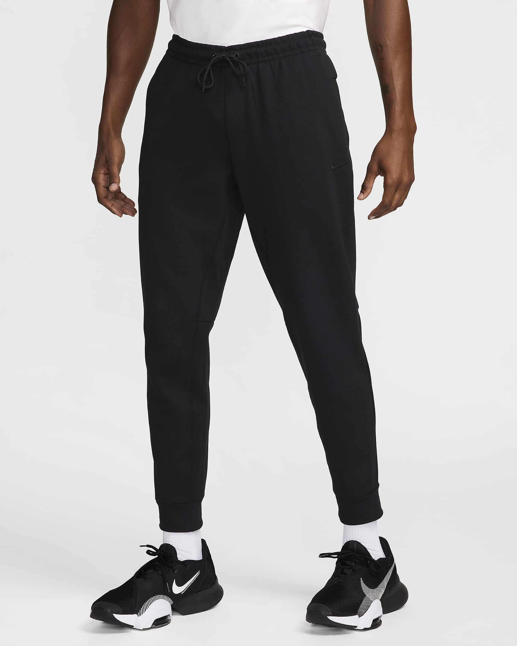 Alsidige Nike Primary Dri-FIT UV-joggers til mænd - sort/sort