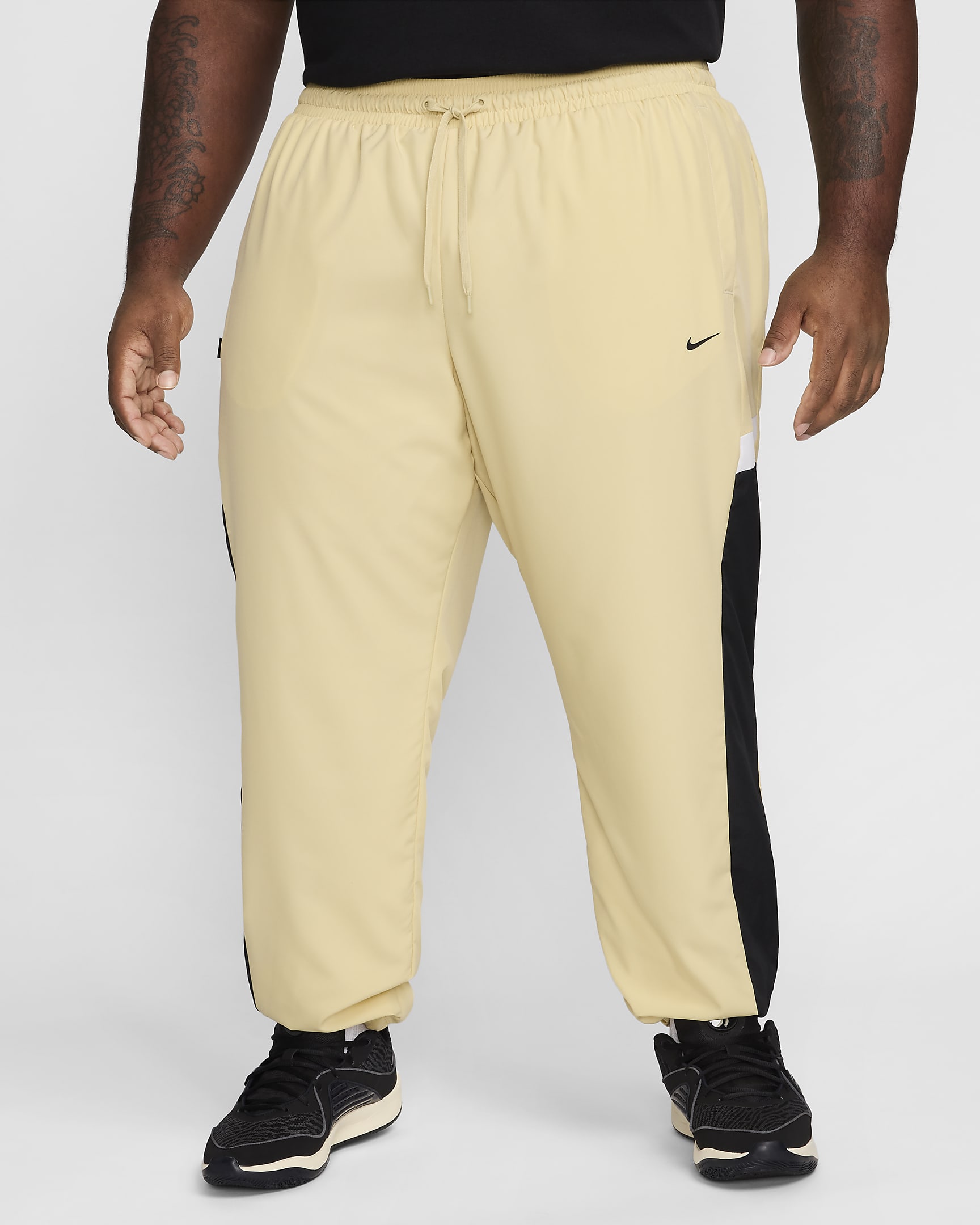 Pantaloni in tessuto da basket Nike Icon – Uomo - Team Gold/Nero/Bianco/Nero