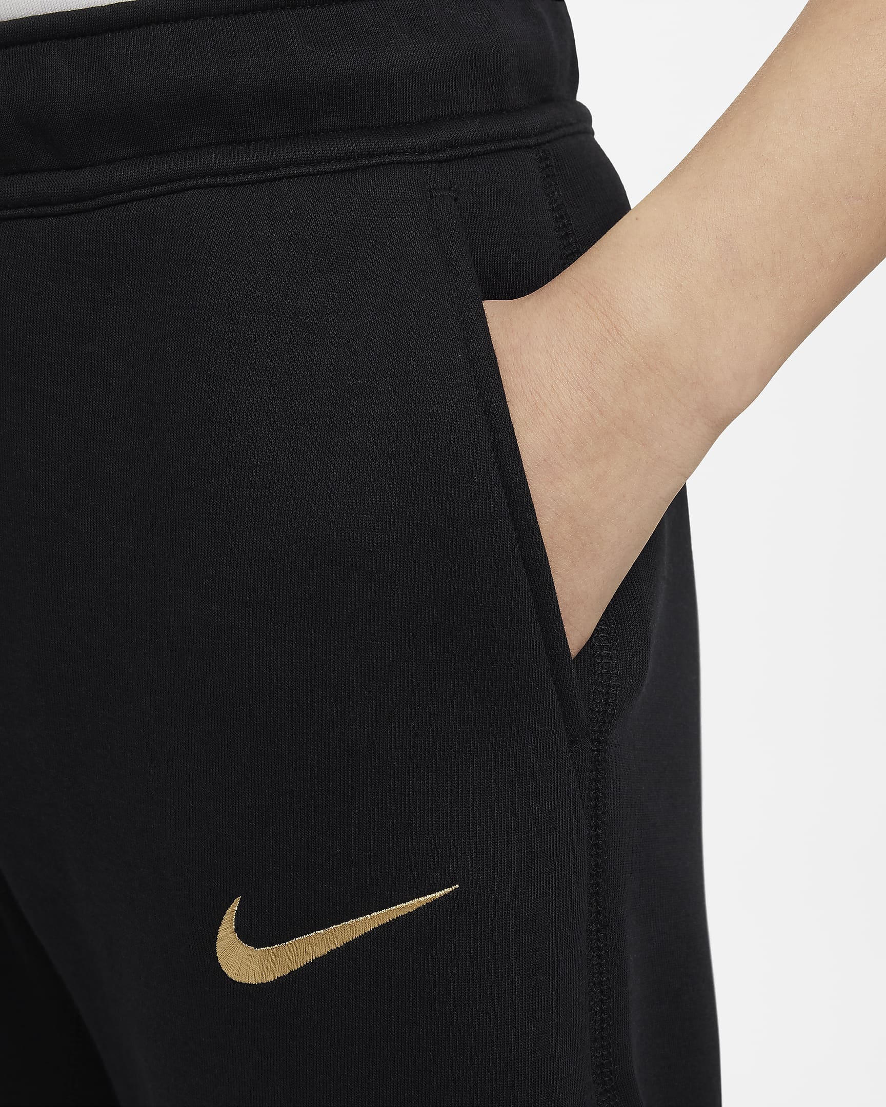 FC Barcelona Tech Fleece Nike voetbalbroek voor jongens - Zwart/Club Gold