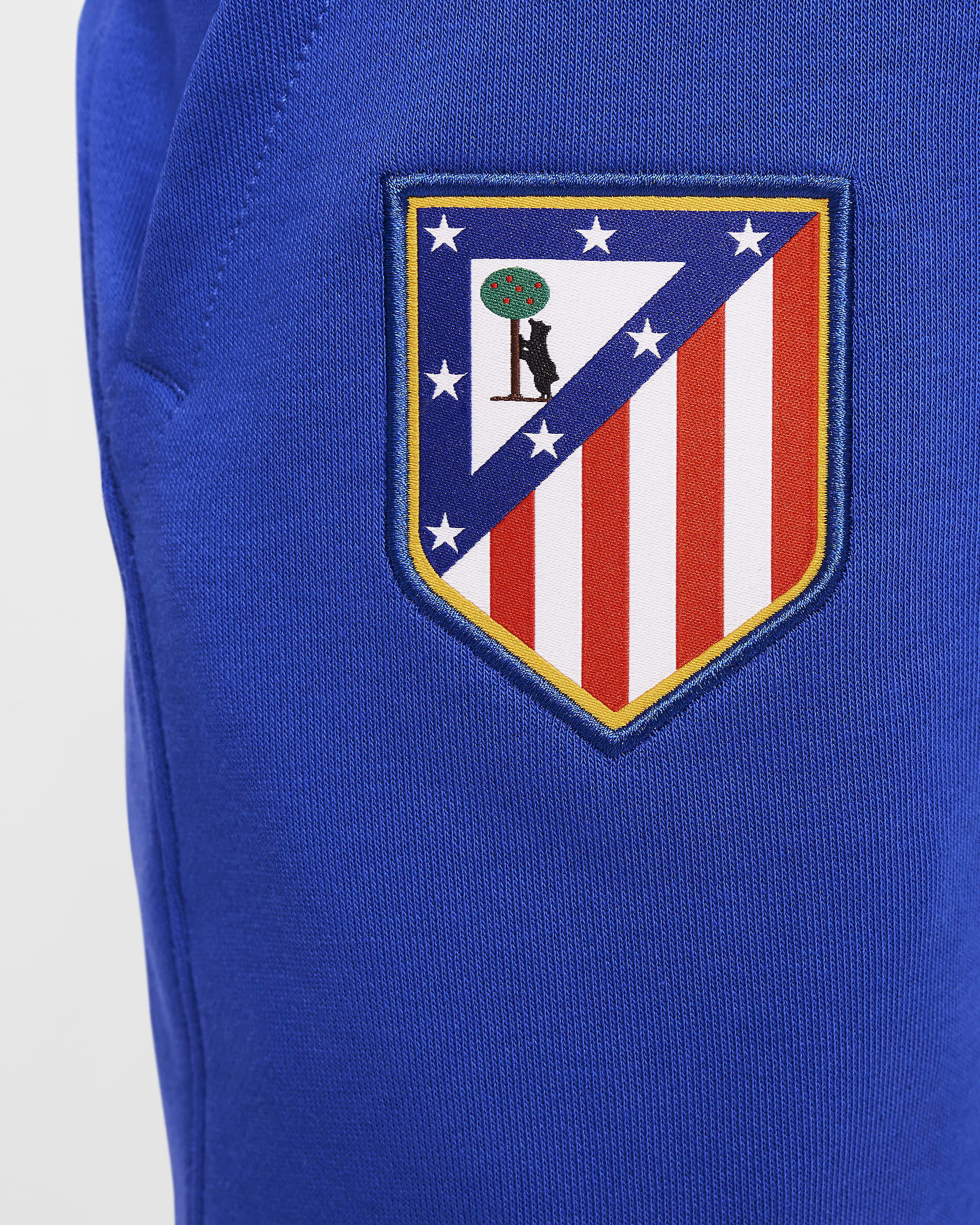 Atlético Madrid Club Thuis Nike voetbaljoggingbroek van sweatstof voor jongens - Game Royal/Light Crimson