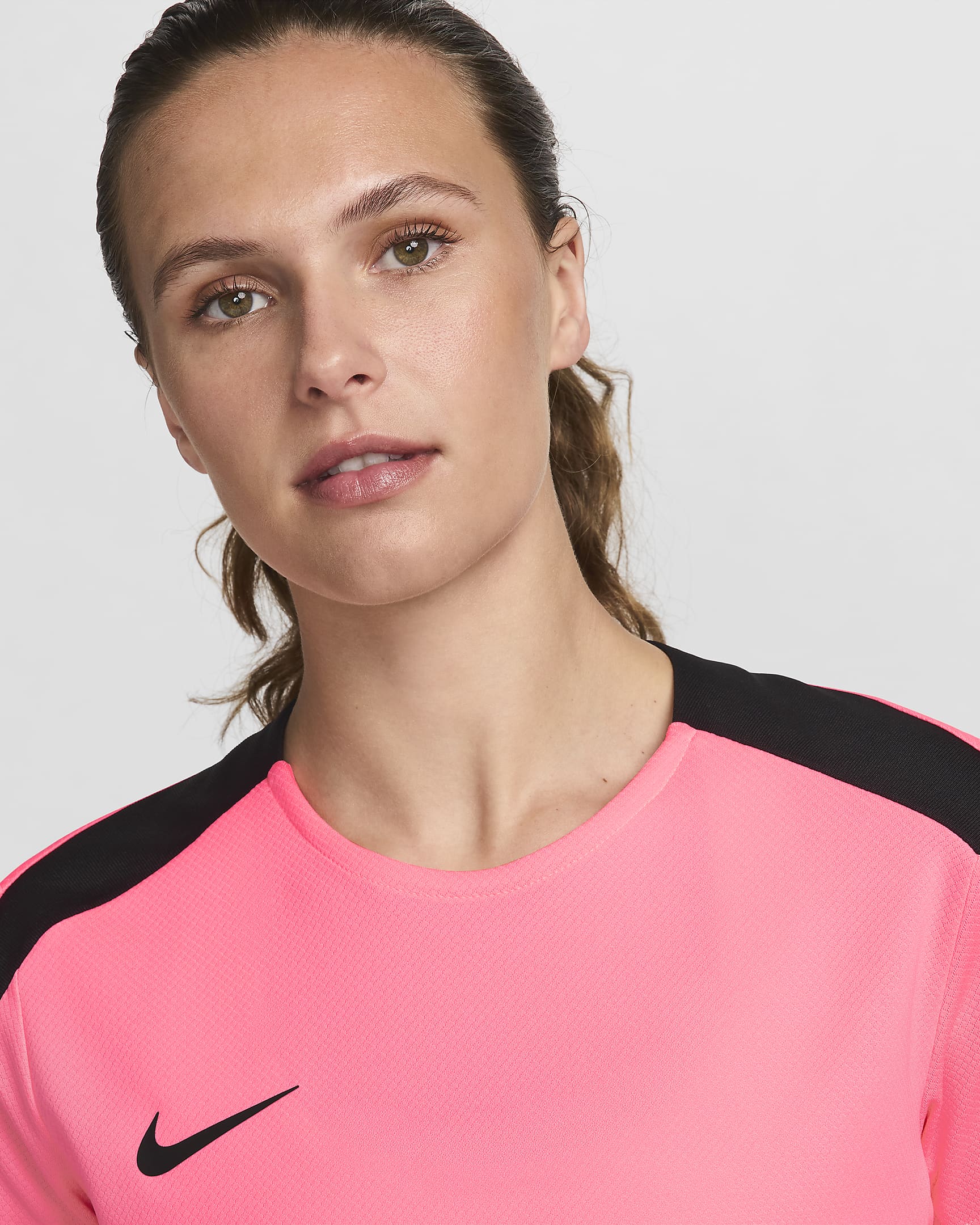 Damska koszulka piłkarska z krótkim rękawem Dri-FIT Nike Strike - Sunset Pulse/Czerń/Czerń