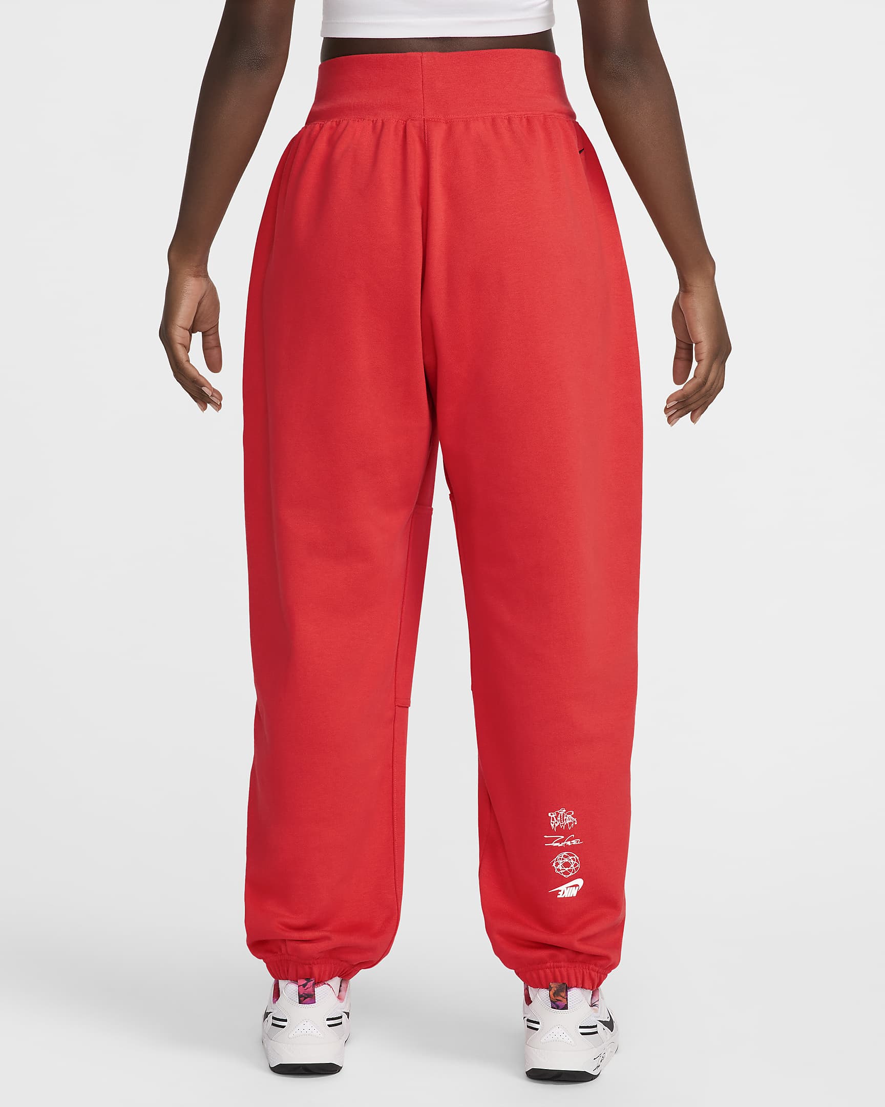 Calças folgadas em tecido moletão e com cintura normal Nike Sportswear Breaking para mulher - Carmesim claro