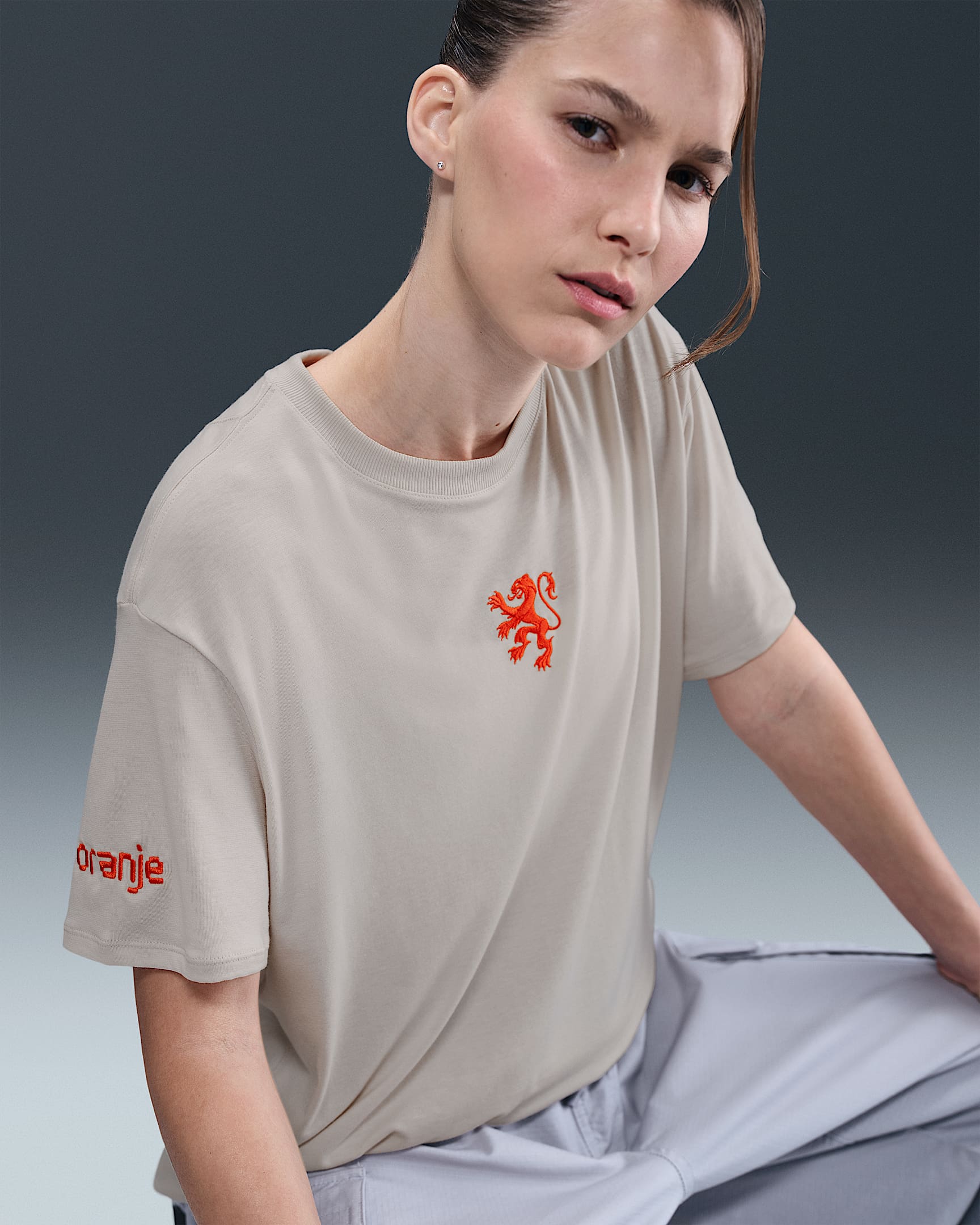 Netherlands Relaxed Women's Nike One Dri-FIT Football Short-Sleeve Top - Light Orewood Brown/Safety Orange/White