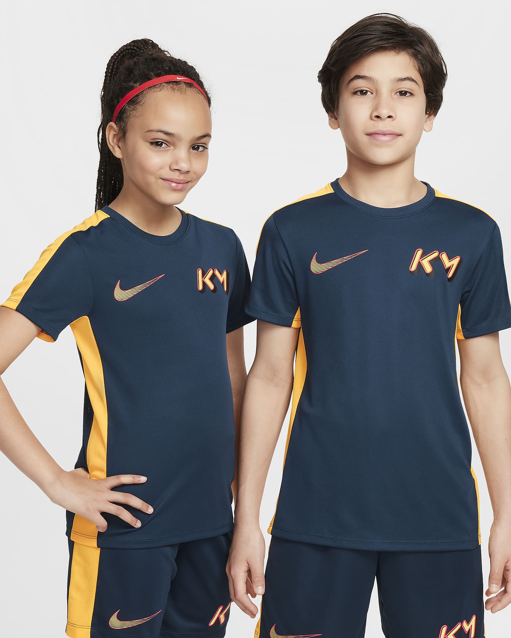 เสื้อฟุตบอลเด็กโต Dri-FIT Academy23 Kylian Mbappé - Armory Navy/Laser Orange