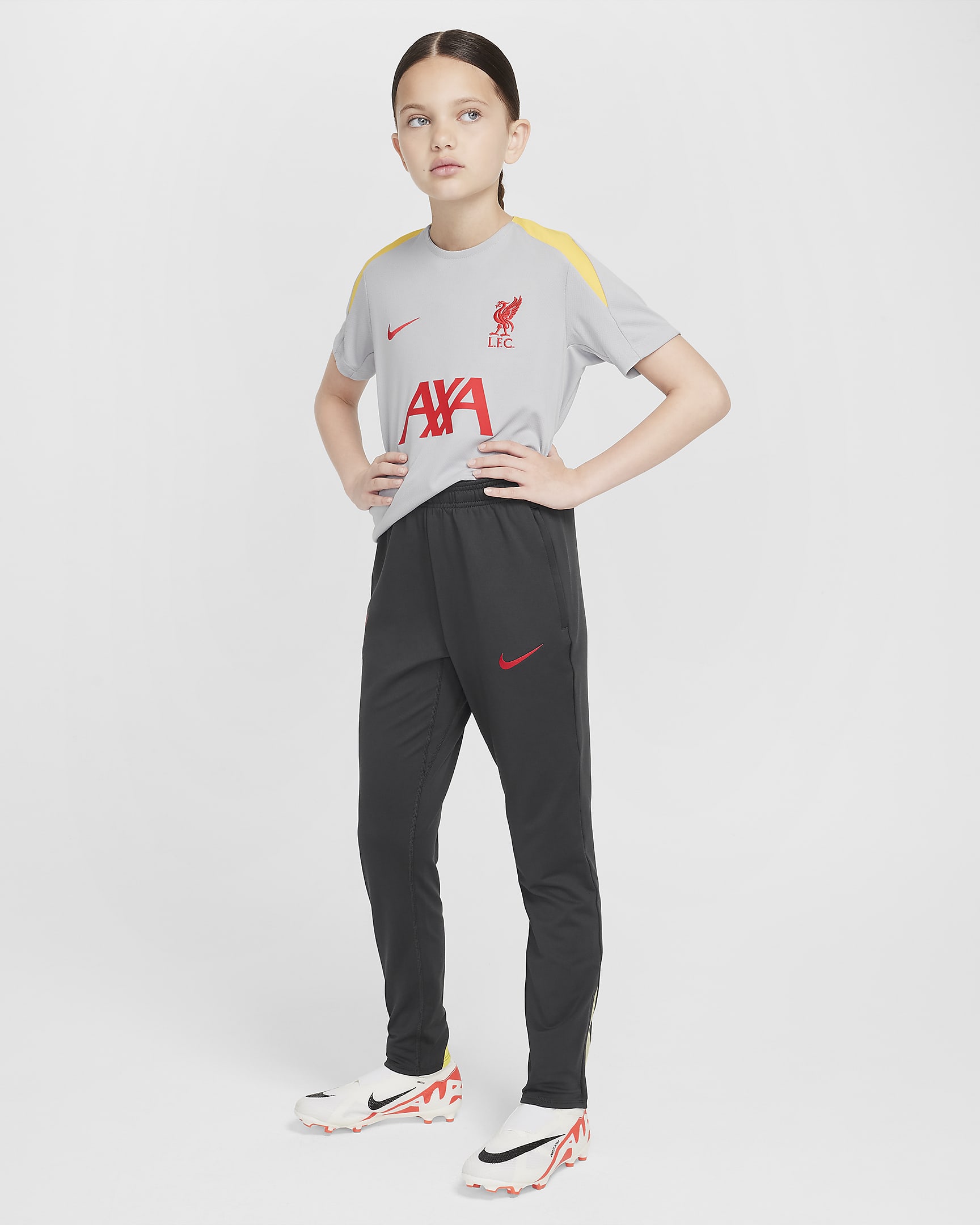 Liverpool F.C. Strike Third Older Kids' Nike Dri-FIT Football Pants - Dark Smoke Grey/Chrome Yellow/Global Red