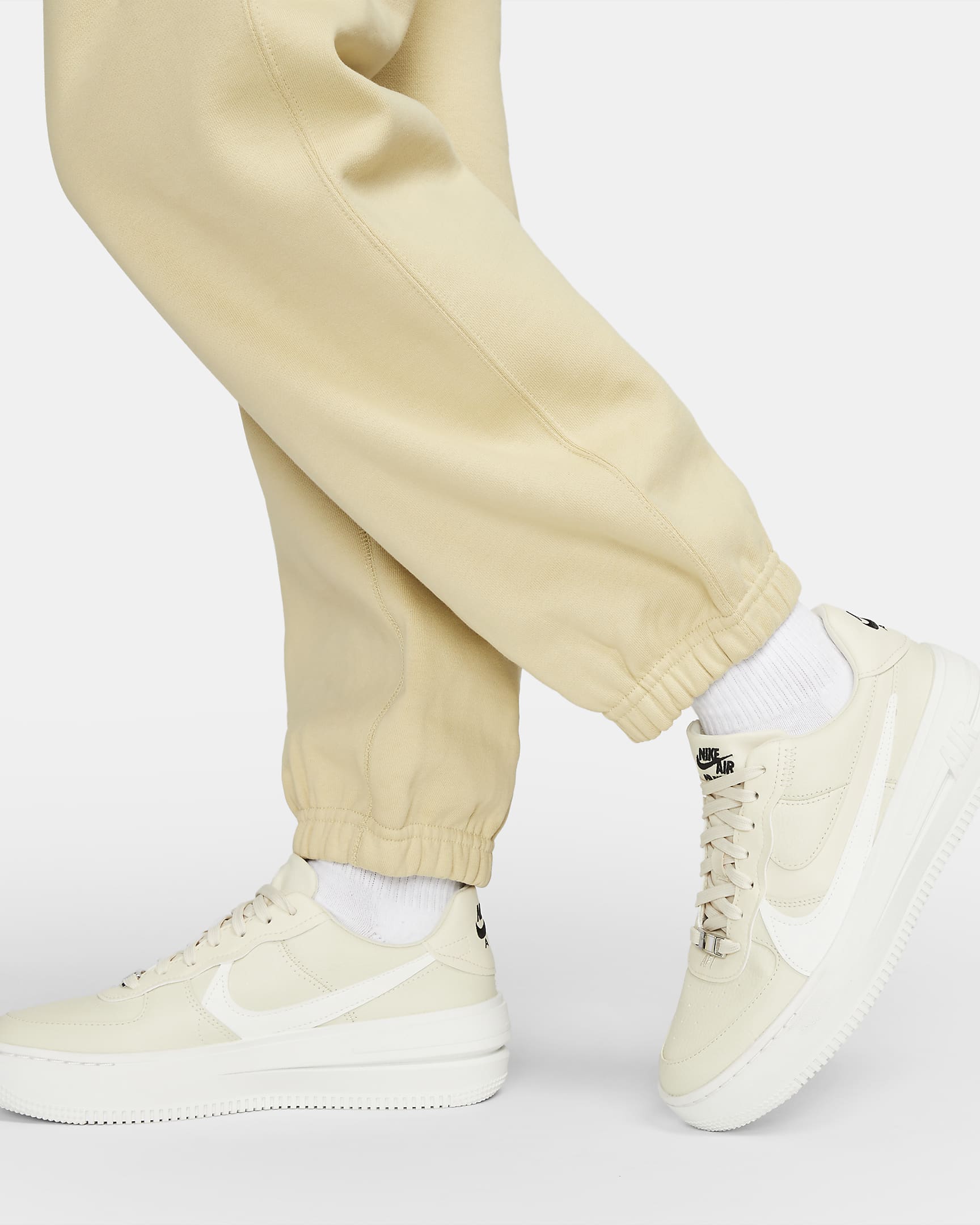 Pantalon en tissu Fleece Nike Solo Swoosh pour Femme - Team Gold/Blanc