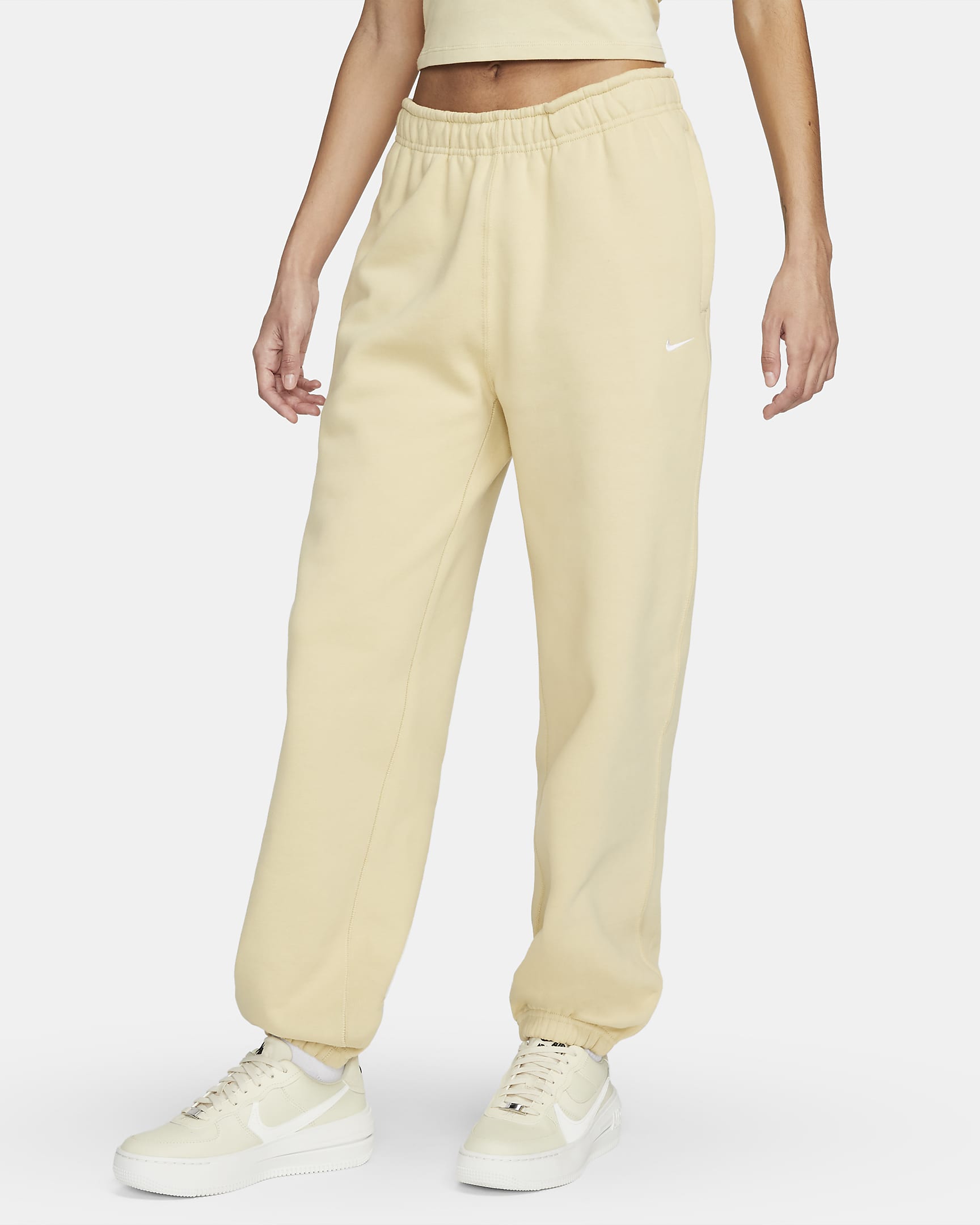 Pantaloni in fleece Nike Solo Swoosh - Donna - Team Gold/Bianco