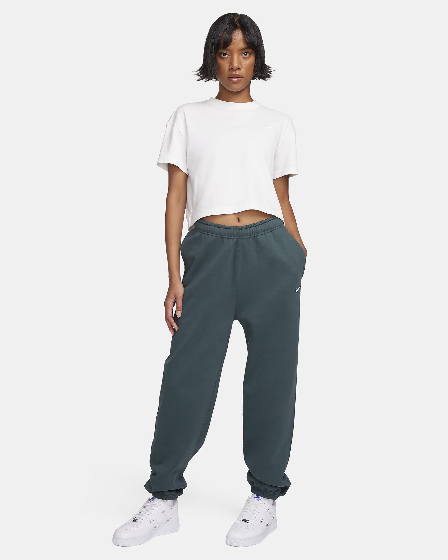 Pantaloni in fleece Nike Solo Swoosh - Donna - Deep Jungle/Bianco