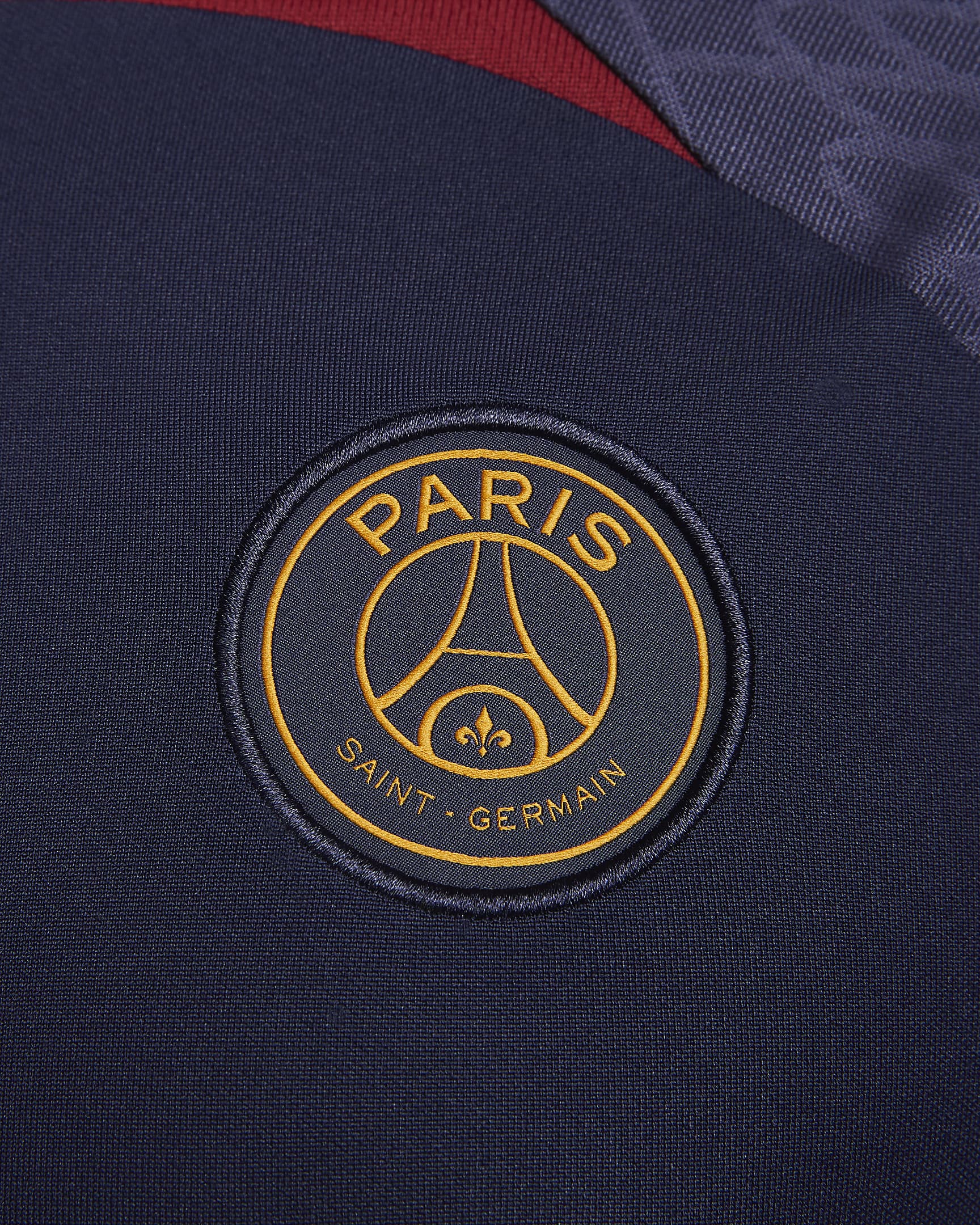 Paris Saint-Germain Strike Men's Nike Dri-FIT Knit Soccer Top - Blackened Blue/Blackened Blue/Team Red/Gold Suede