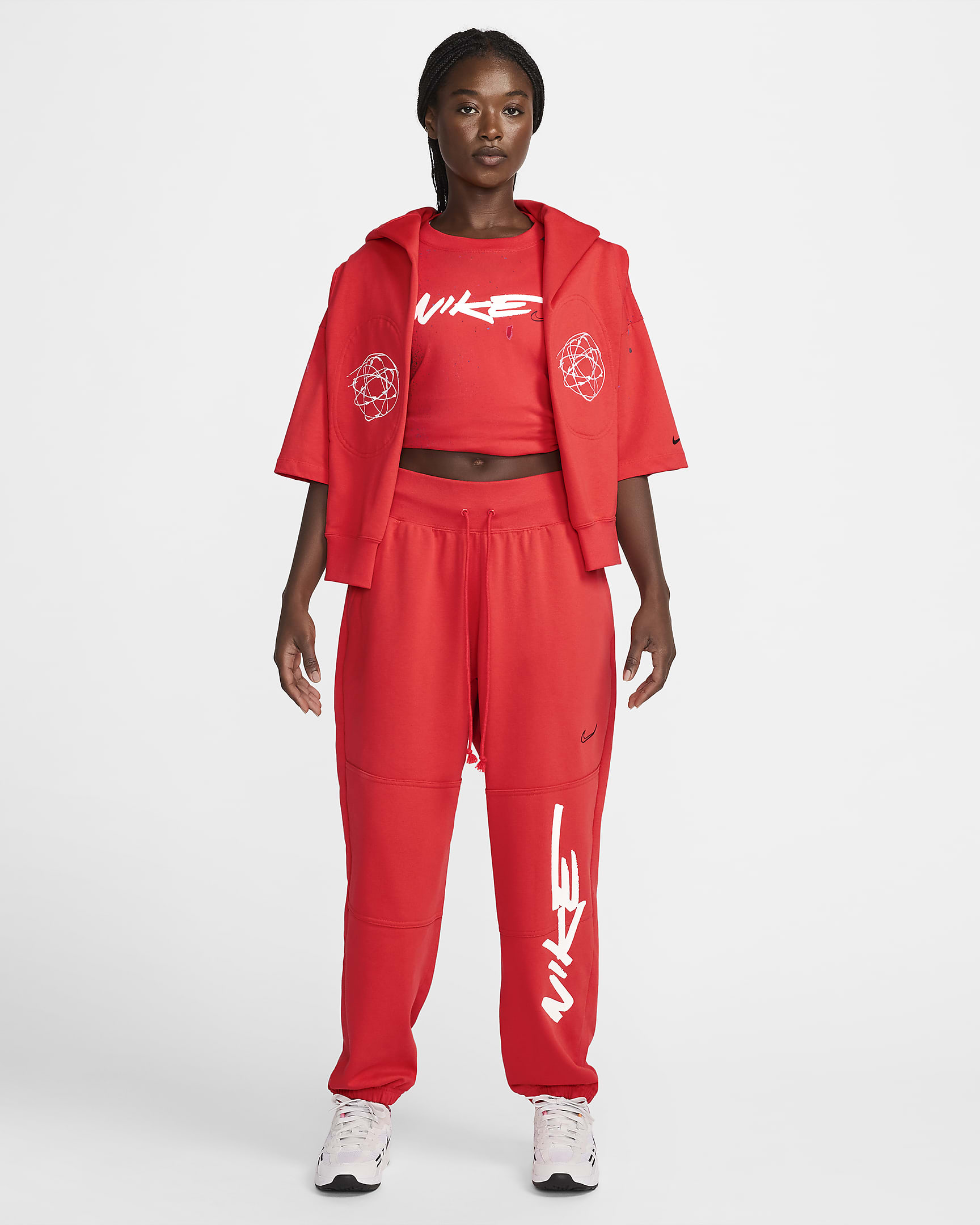 Calças folgadas em tecido moletão e com cintura normal Nike Sportswear Breaking para mulher - Carmesim claro