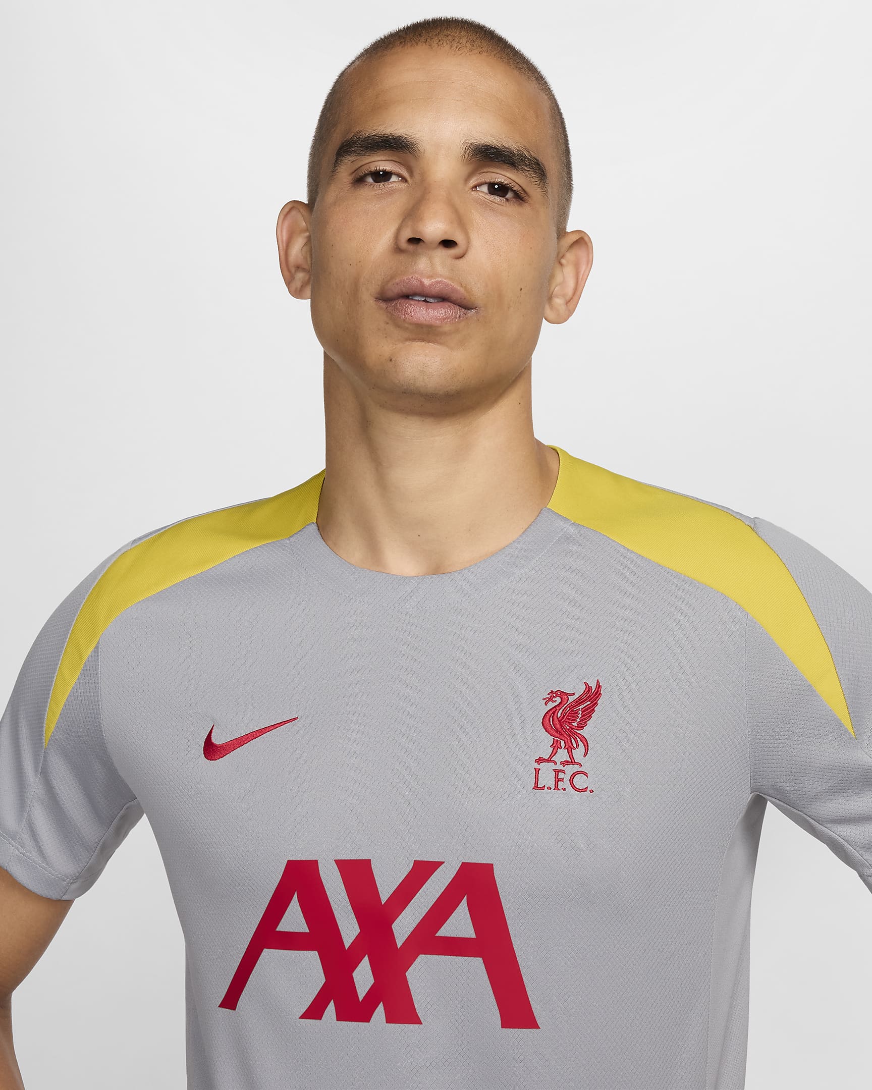 Męska dzianinowa koszulka piłkarska z krótkim rękawem Nike Dri-FIT Liverpool F.C. Strike (wersja trzecia) - Light Smoke Grey/Light Smoke Grey/Chrome Yellow/Global Red