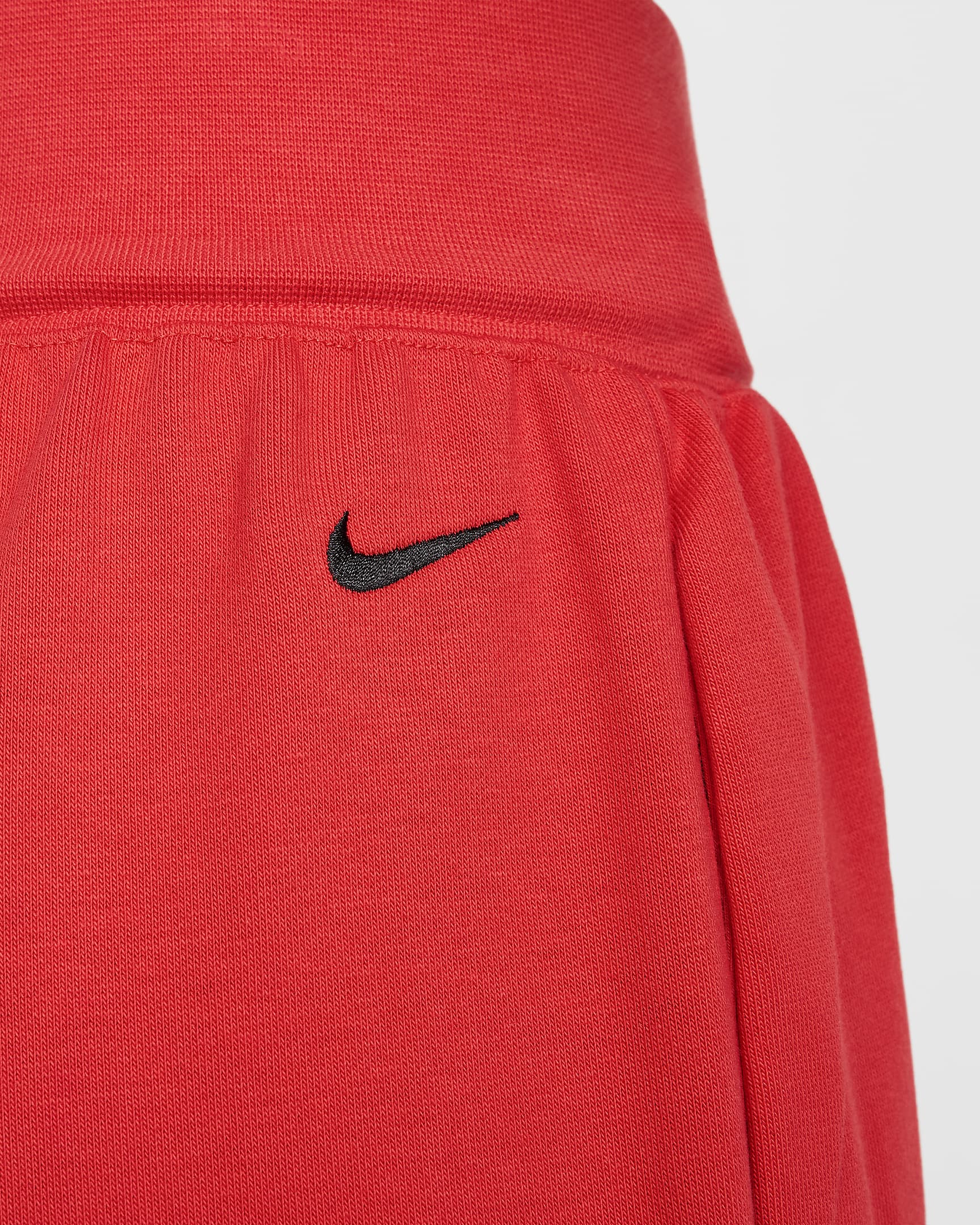 Nike Sportswear Breaking Pantalón oversize de talle medio y tejido French terry - Mujer - Carmesí claro