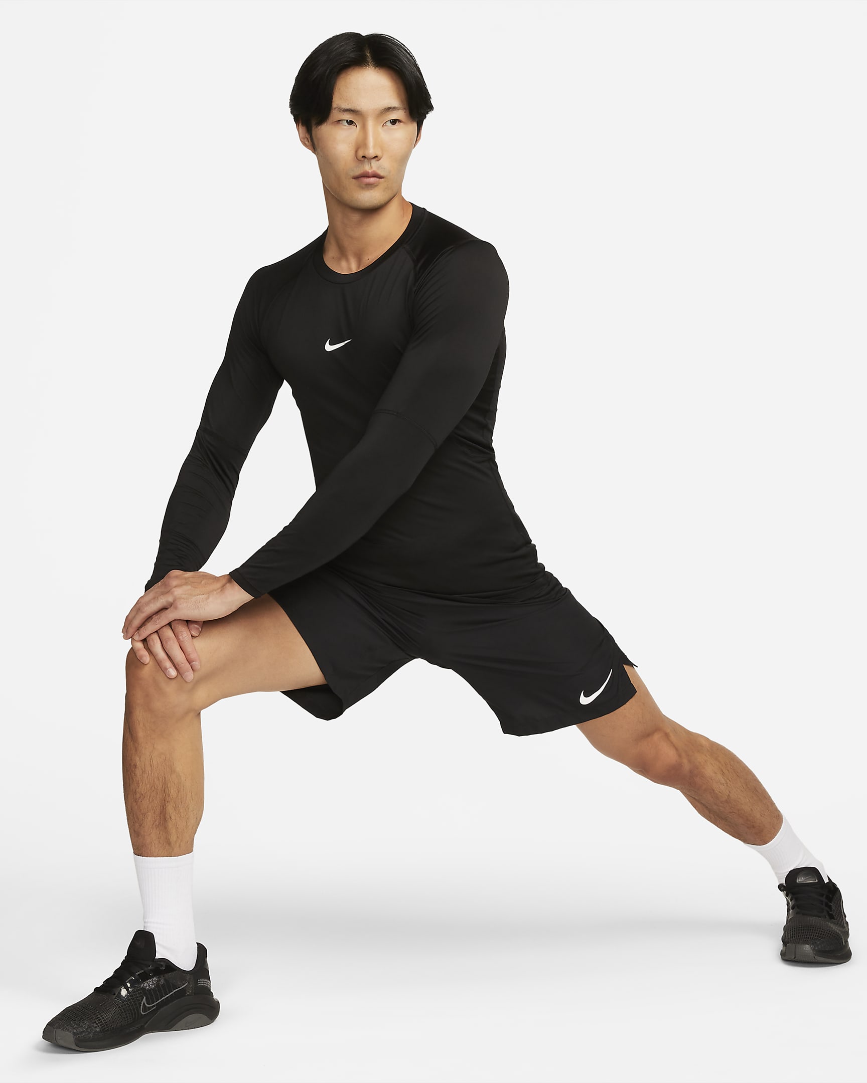 Nike Pro Dri-FIT strakke fitnesstop met lange mouwen voor heren - Zwart/Wit