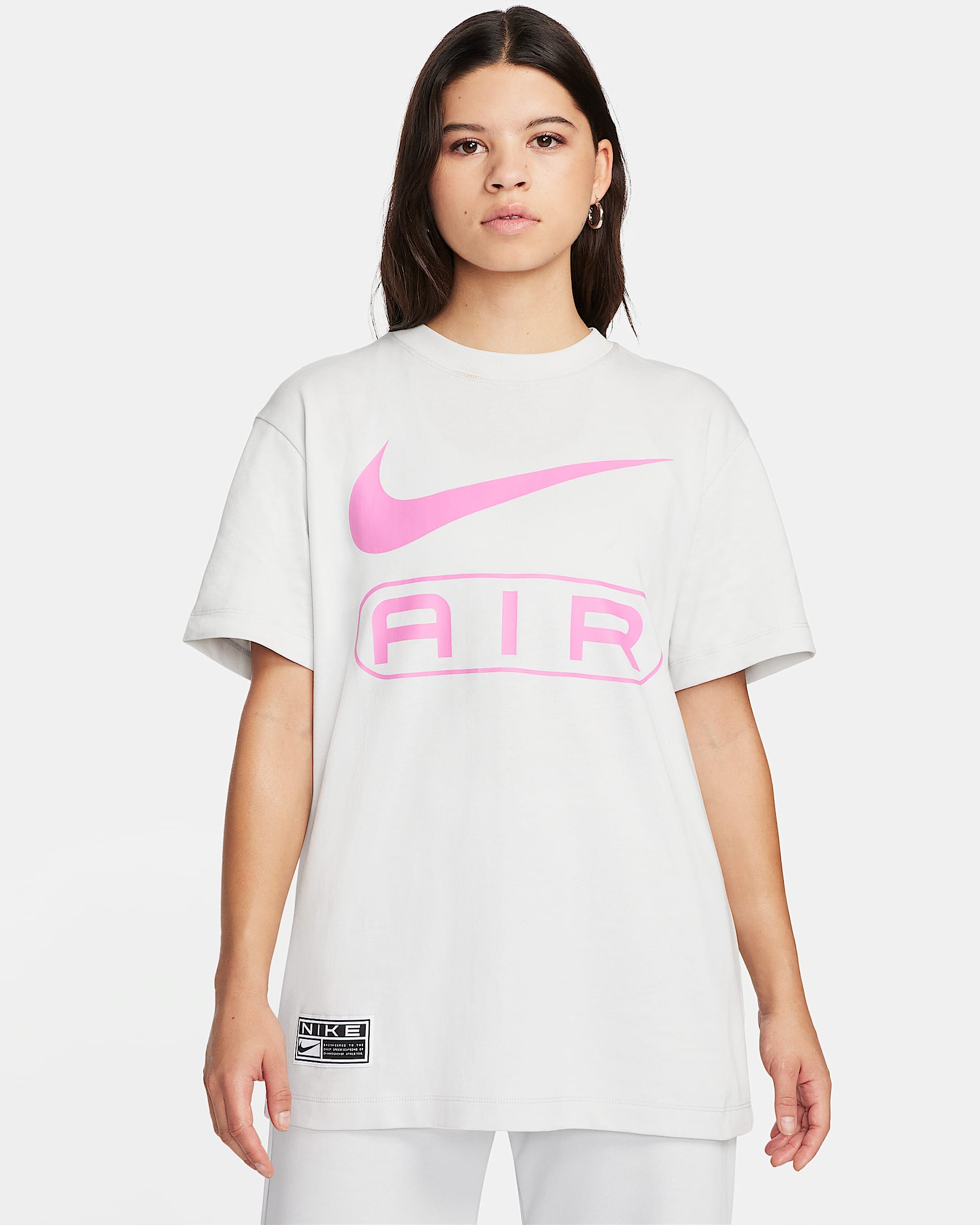 Playera con ajuste holgado para mujer Nike Air - Polvo fotón/Rosa alegre