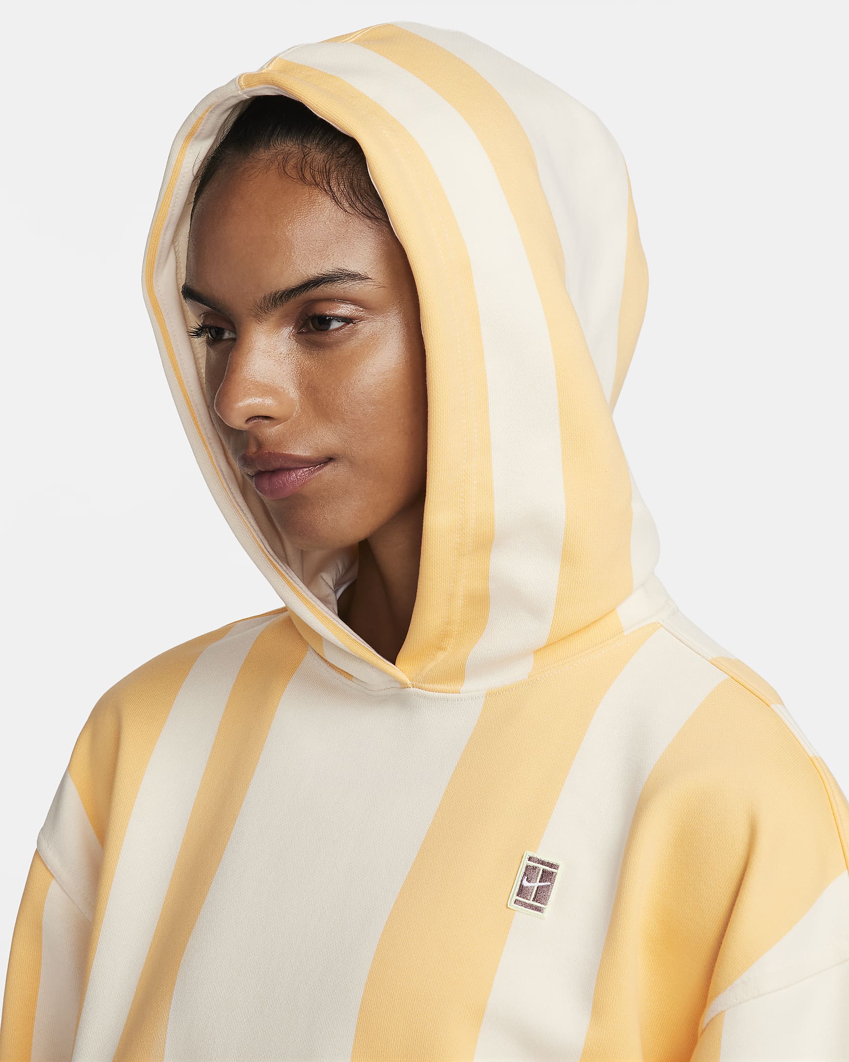 NikeCourt Heritage Women's Dri-FIT Printed Tennis Hoodie - Topaz Gold/Coconut Milk