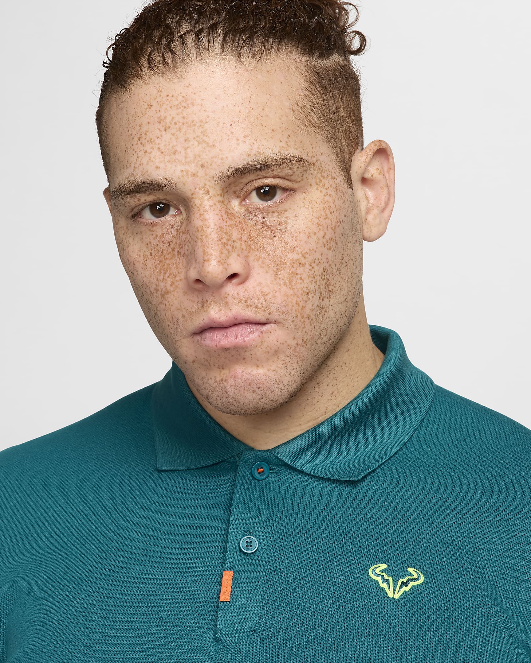 The Nike Polo Rafa Herren-Poloshirt in schmaler Passform - Geode Teal/Volt