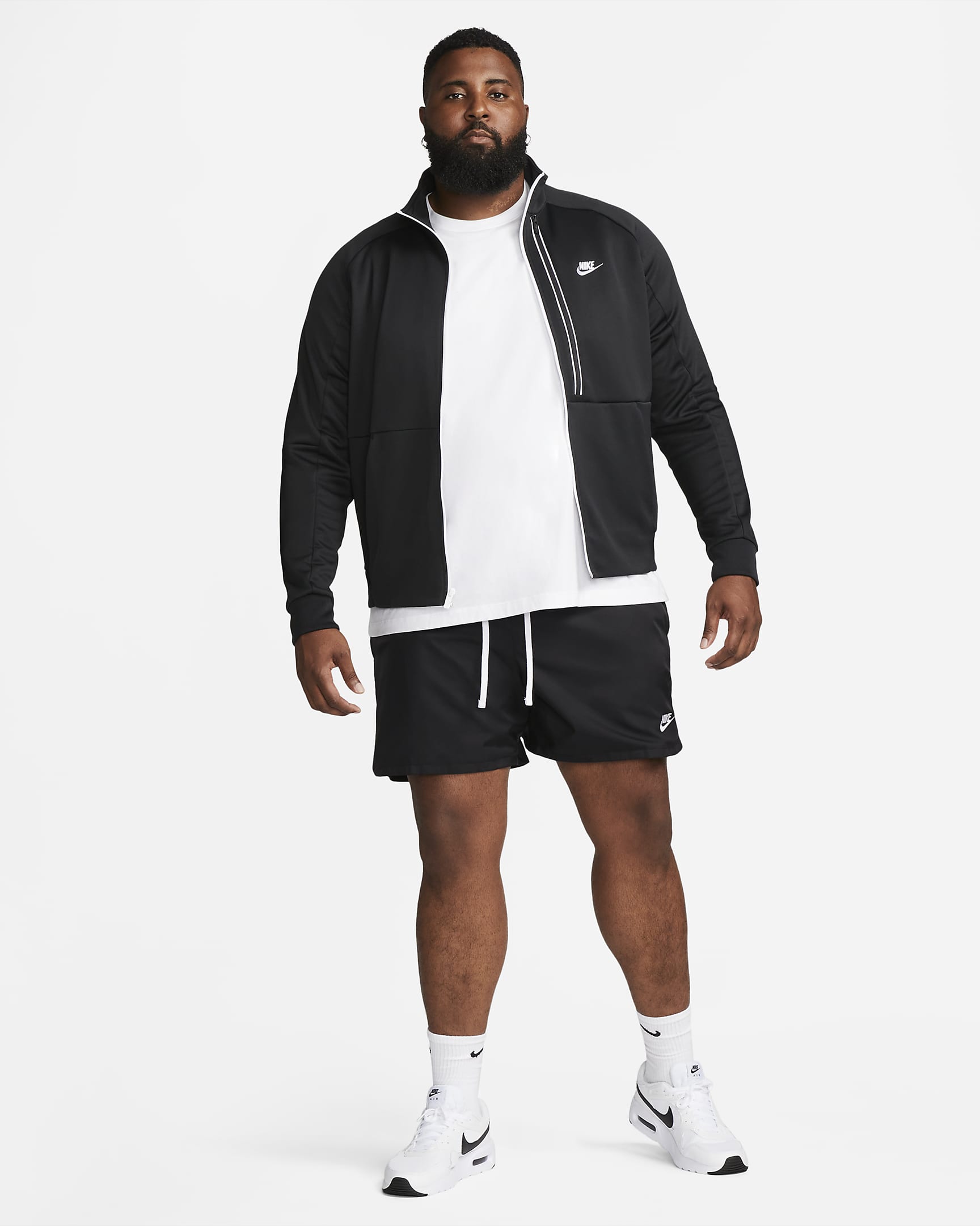 Shorts Flow in tessuto con fodera Nike Sportswear Sport Essentials - Uomo - Nero/Bianco