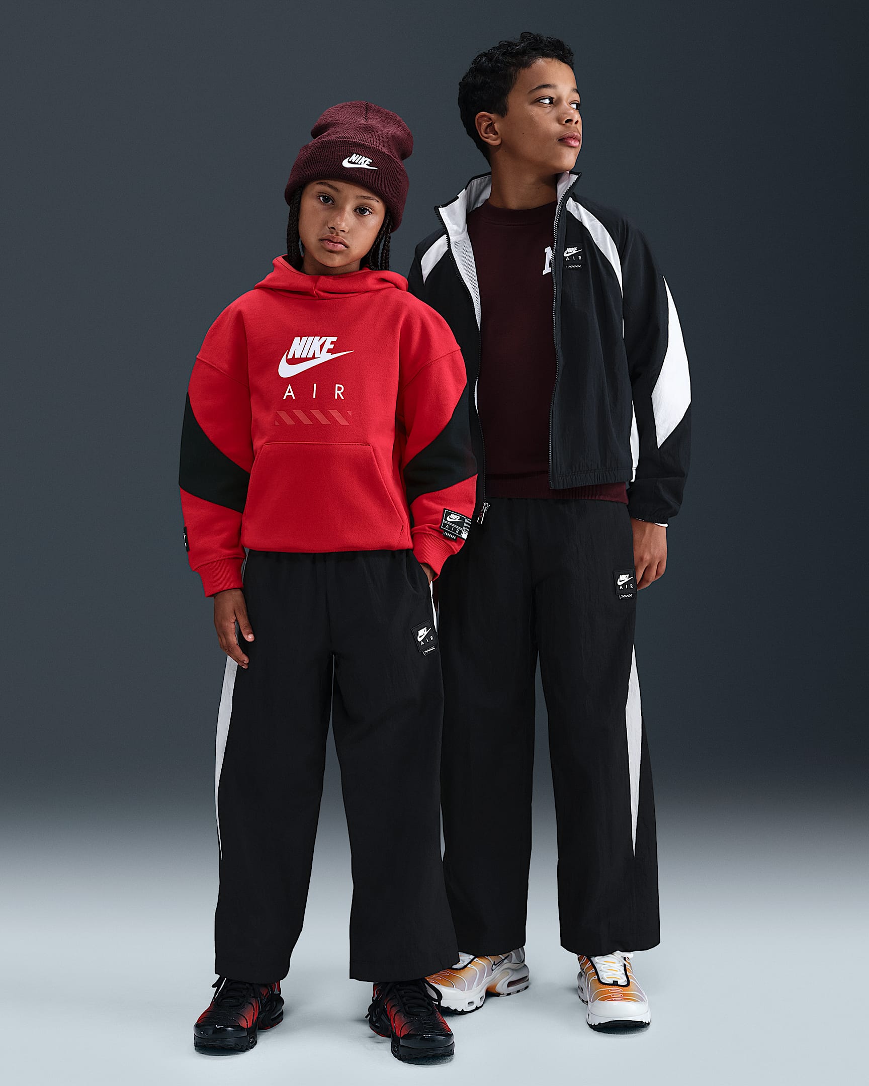 Tkané sportovní kalhoty Nike Air pro větší děti - Černá/Bílá/Bílá