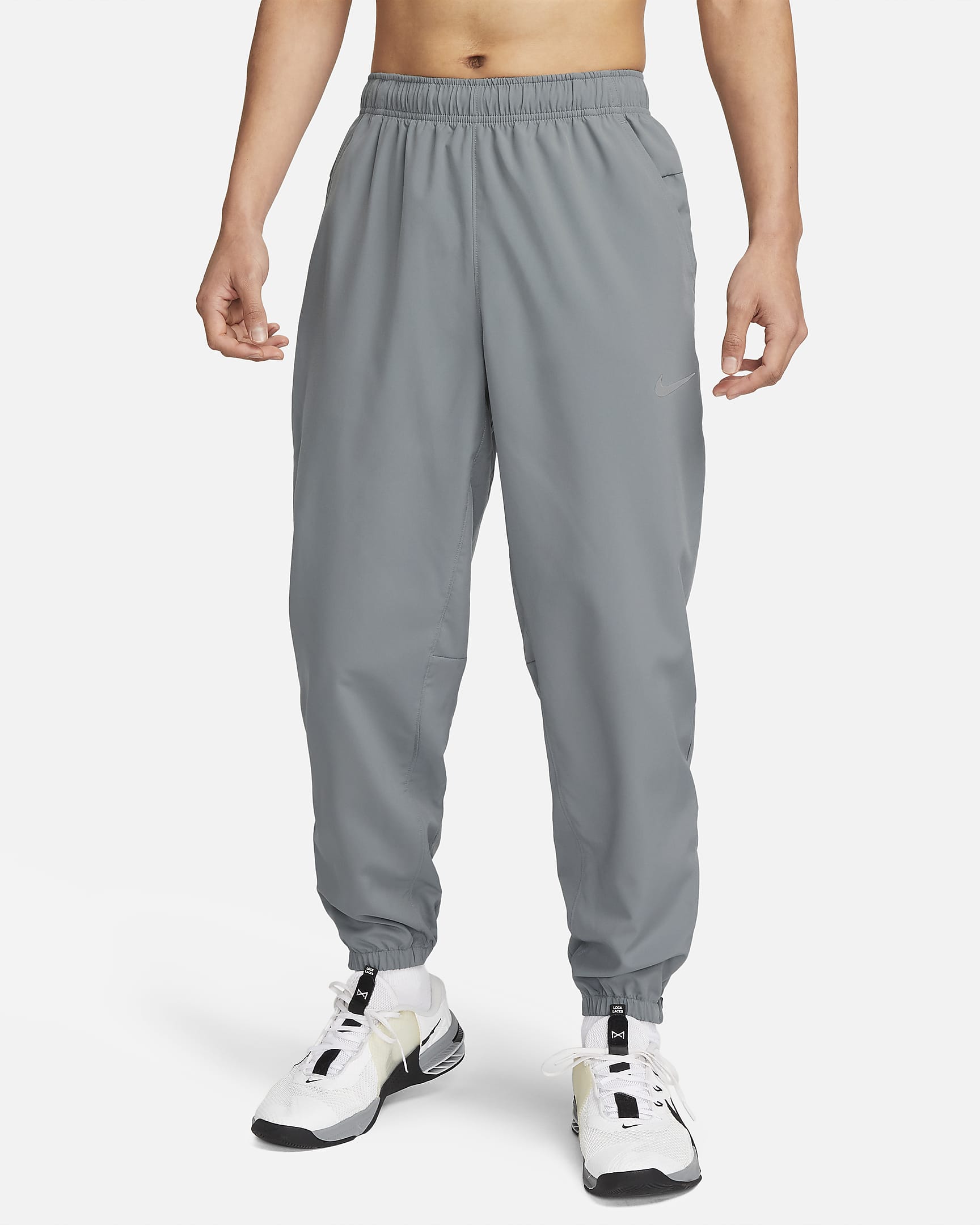 Pants Dri-FIT entallados versátiles para hombre Nike Form - Gris humo/Negro