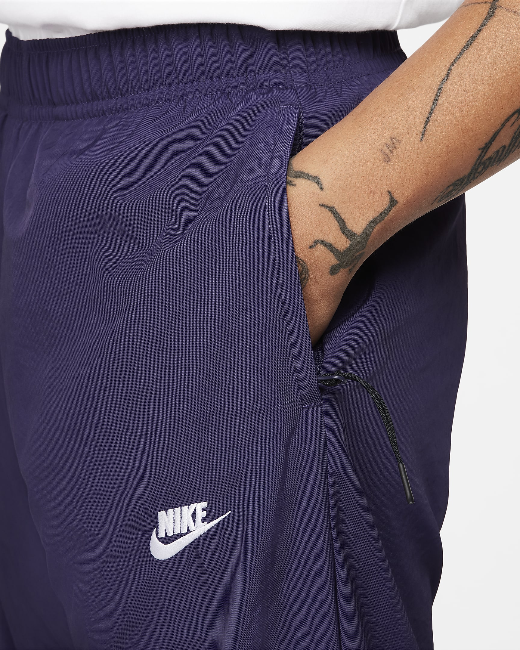 Pantalon d‘hiver tissé Nike Windrunner pour homme - Purple Ink/Blanc