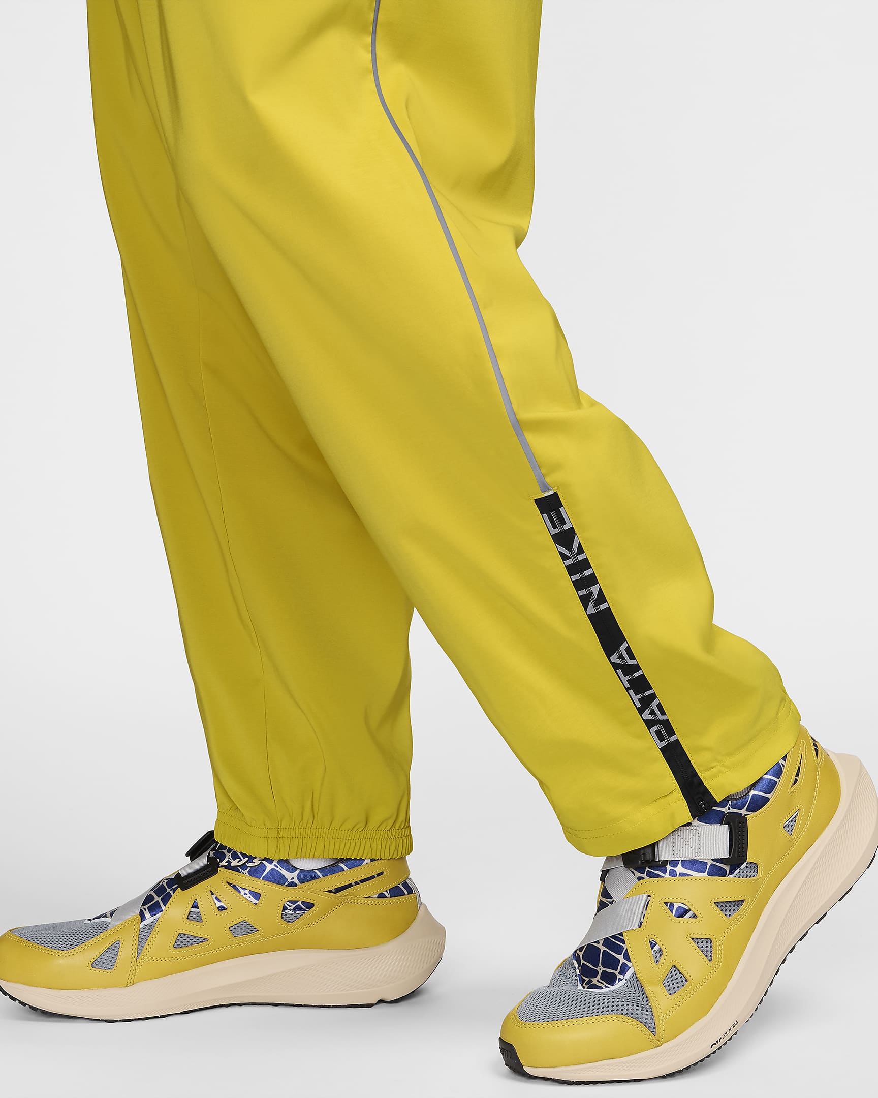 Nike x Patta Running Team Men's Tracksuit Bottoms - Saffron Quartz