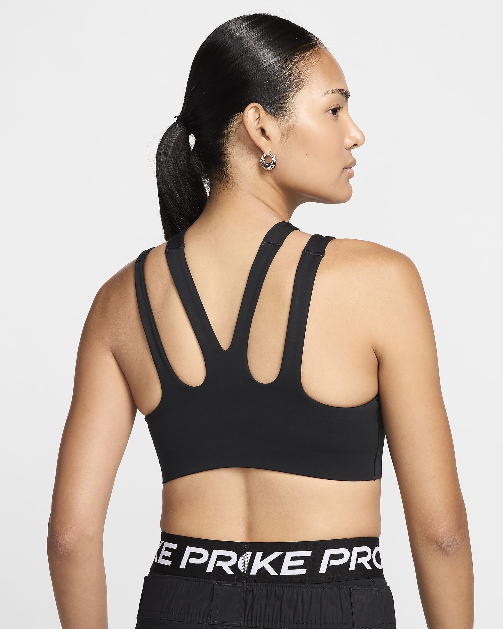 Nike Freestyle Sujetador deportivo de sujeción ligera con almohadilla - Mujer - Negro/Blanco