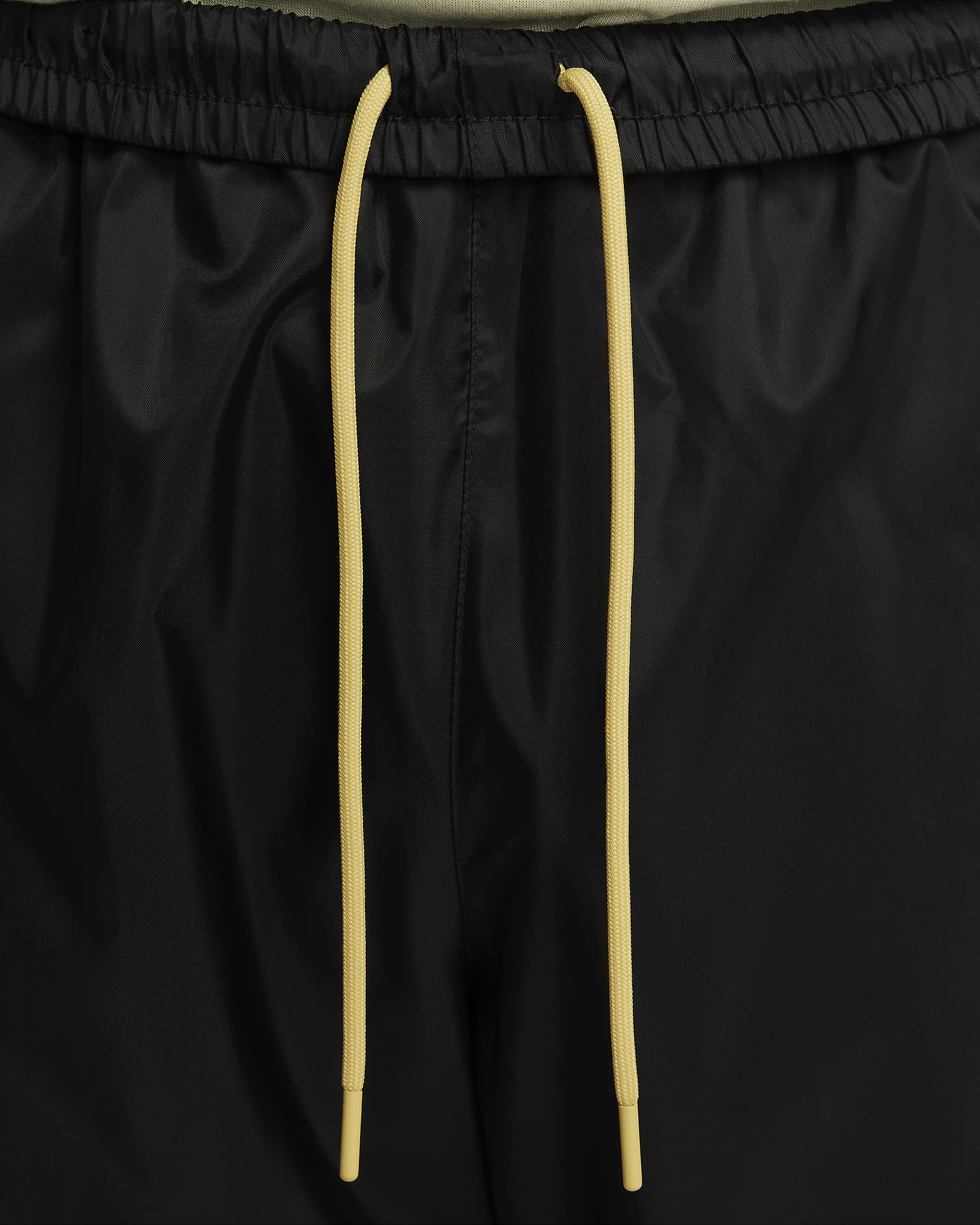 Nike Windrunner vevd bukse med fôr til herre - Svart/Dark Stucco/Saturn Gold